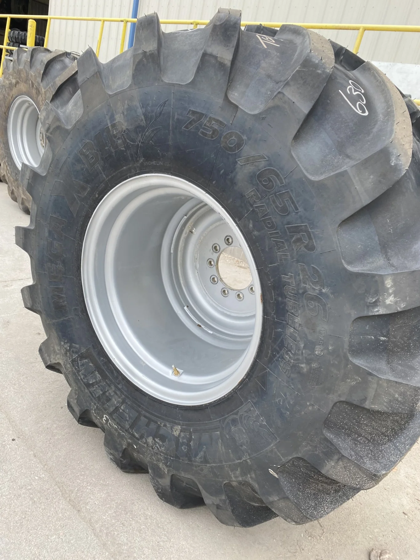 Used 95% 750/65R26 Michelin MegaXbib R-1W 171A8/171B TL on a 25 X 26 CIH Silver 10 Bolt Rear image 2