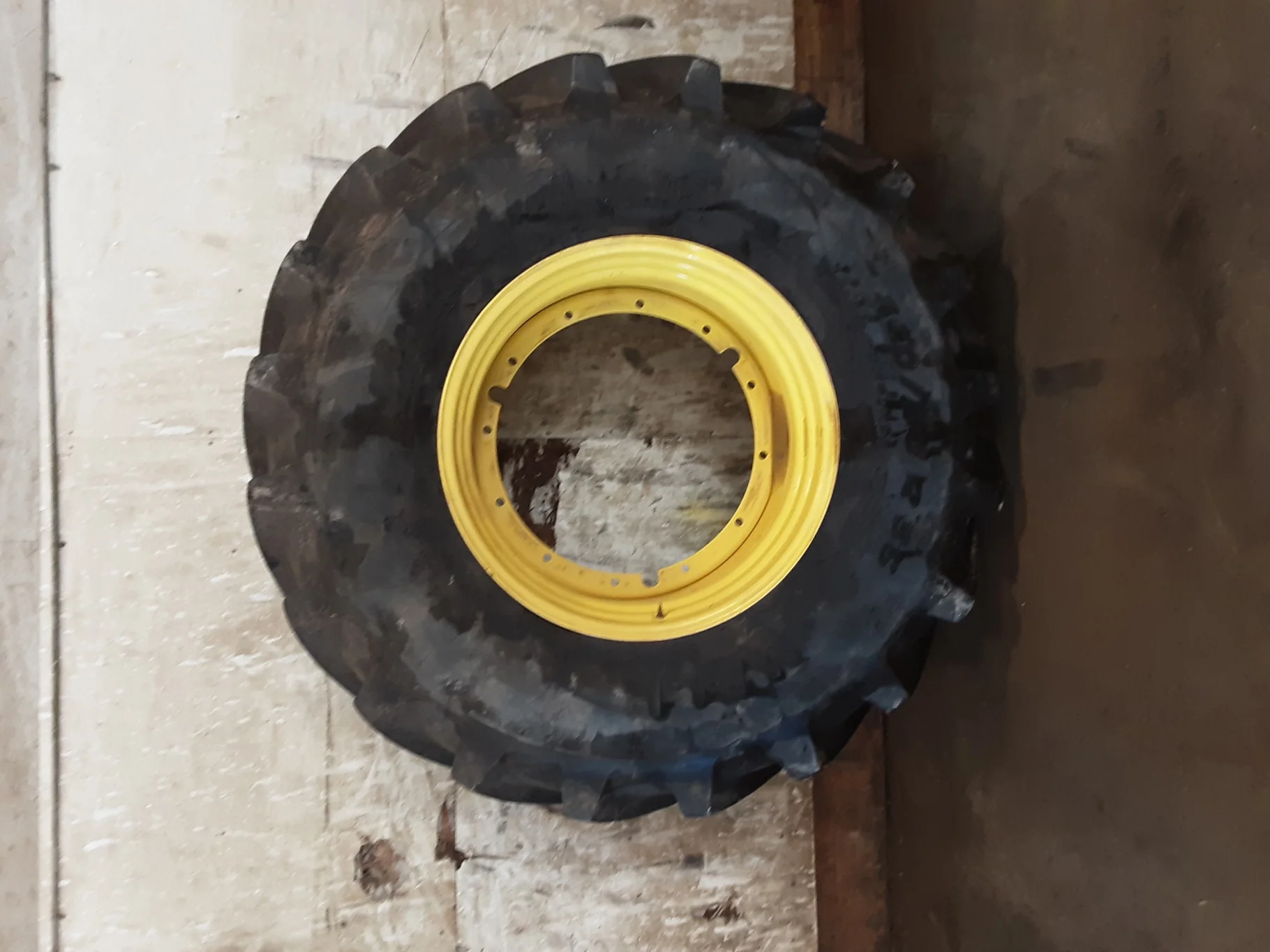 Used 95% 650/85R38 Michelin MachXBib R-1W 173A8/173B TL on a 23 x 38 JD Yellow 12 Bolt (.937)