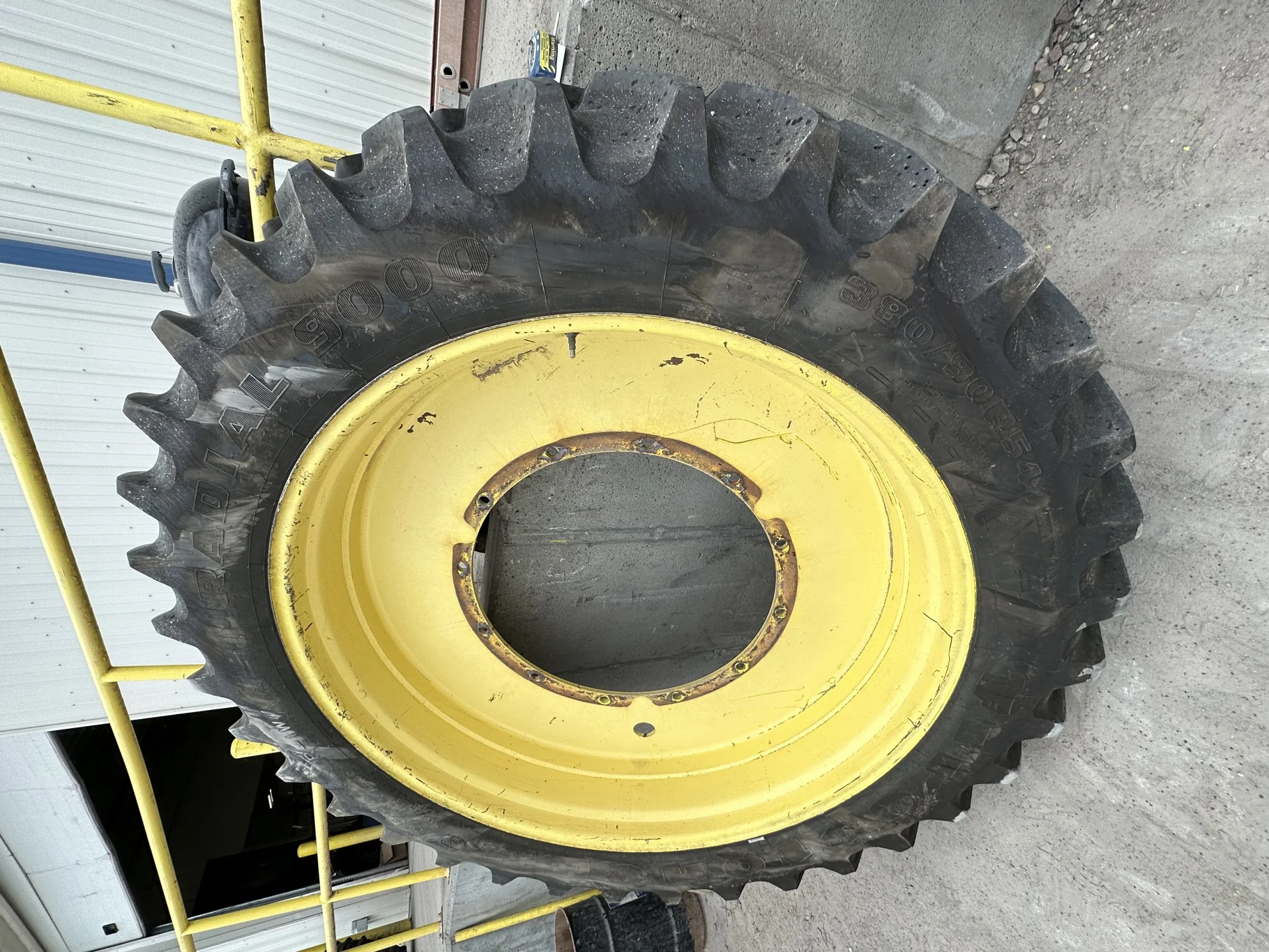 Used 87% 380/90R54 Firestone Radial 9000 TL on a 12 x 54 JD Yellow 12 Bolt (.937) Stub Disc (1