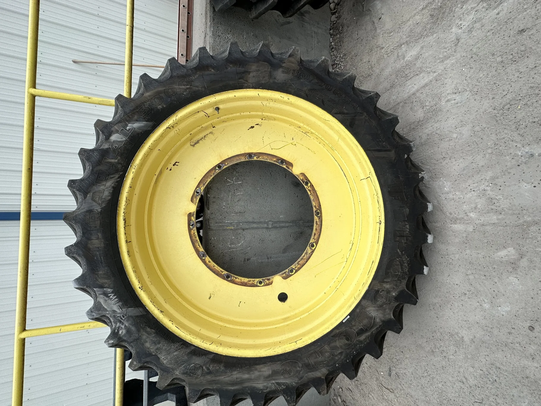 Used 87% 380/90R54 Firestone Radial 9000 TL on a 12 x 54 JD Yellow 12 Bolt (.937) Stub Disc (1 image 2
