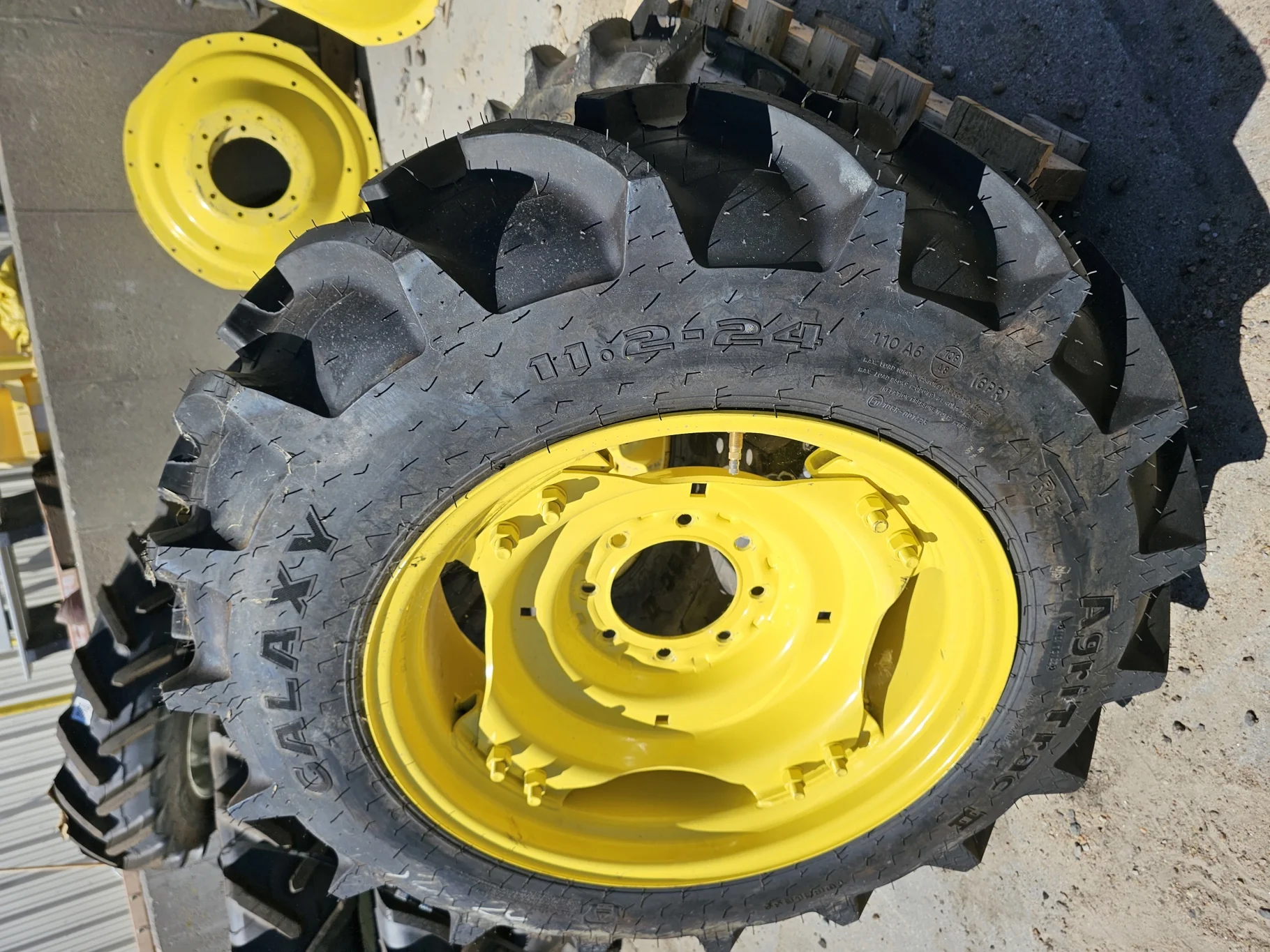 Take Off 11.2-24 Galaxy Agri Trac II R1 C(6Ply) on a 10 X 24 John Deere Yellow Waffle Wheel (2 Bolt)