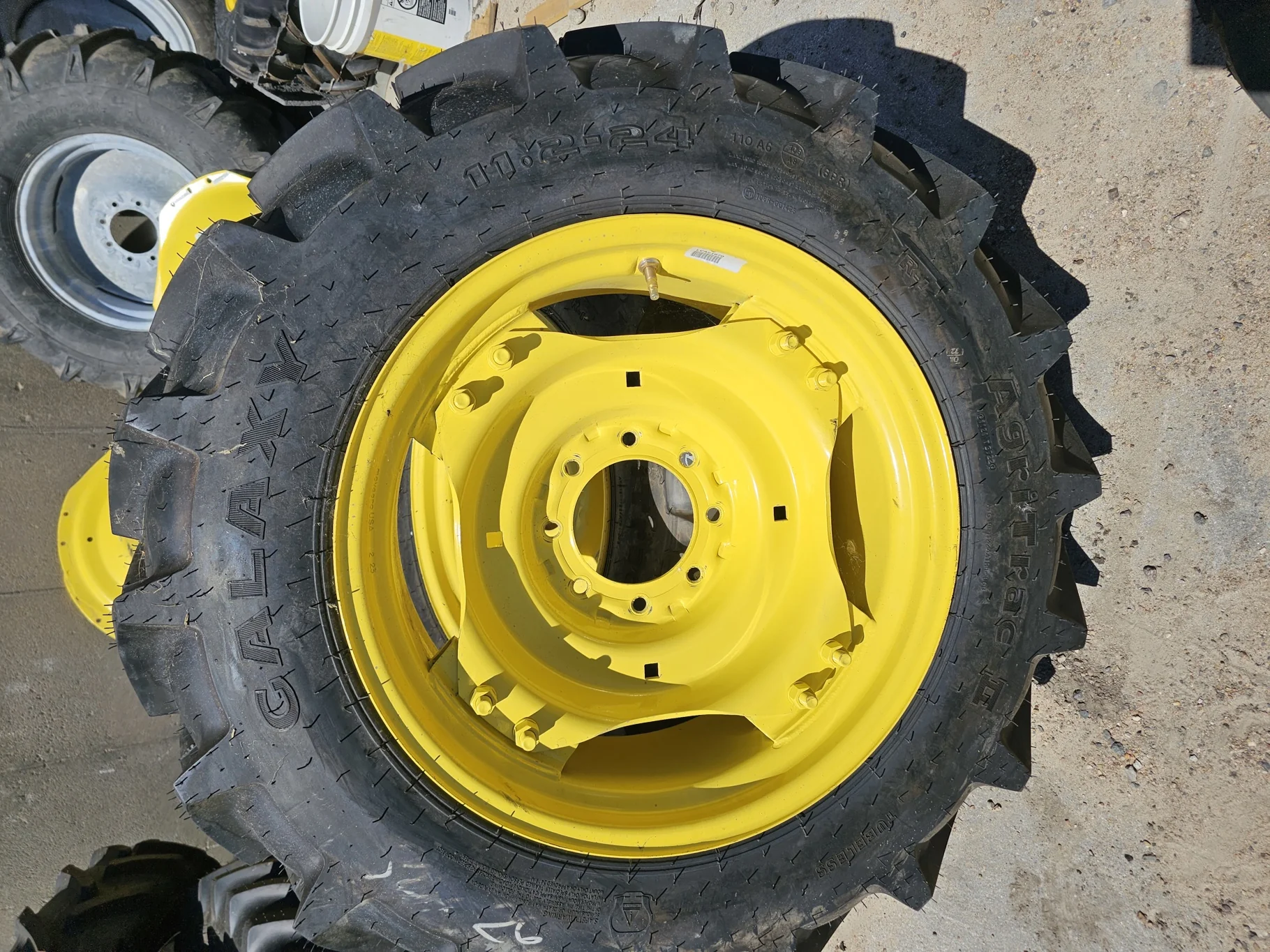 Take Off 11.2-24 Galaxy Agri Trac II R1 C(6Ply) on a 10 X 24 John Deere Yellow Waffle Wheel (2 Bolt) image 2