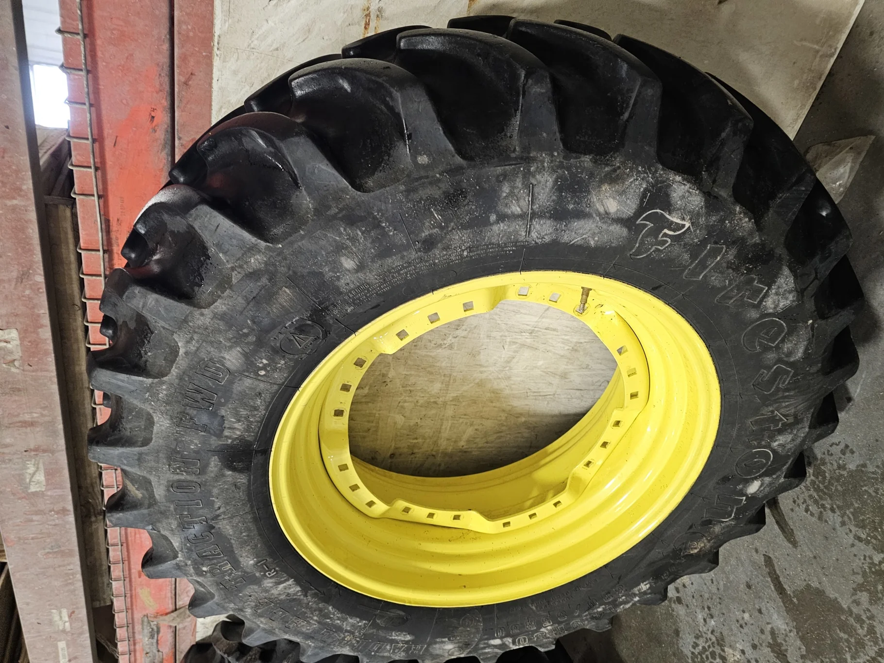 Used 60% 380/85R30 Firestone Radial All Traction FWD R-1 (135B) TL on a 13 x 30 JD Yellow (3 B