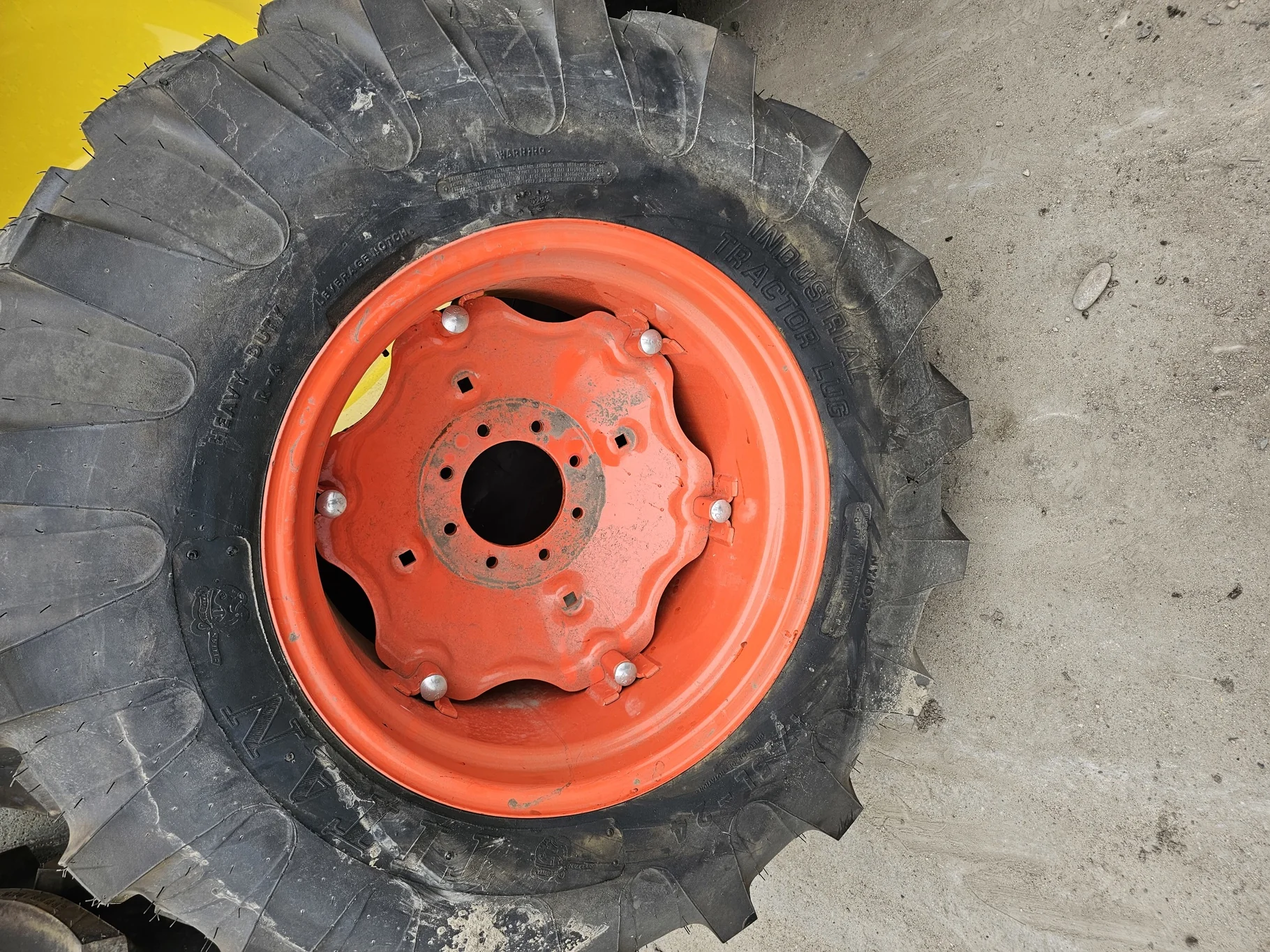 Take Off 17.5L-24 Titan Industrial Tractor Lug R-4 D(8Ply) TL on a 15 X 24 Kubota Orange 6 Loop Whee image 2