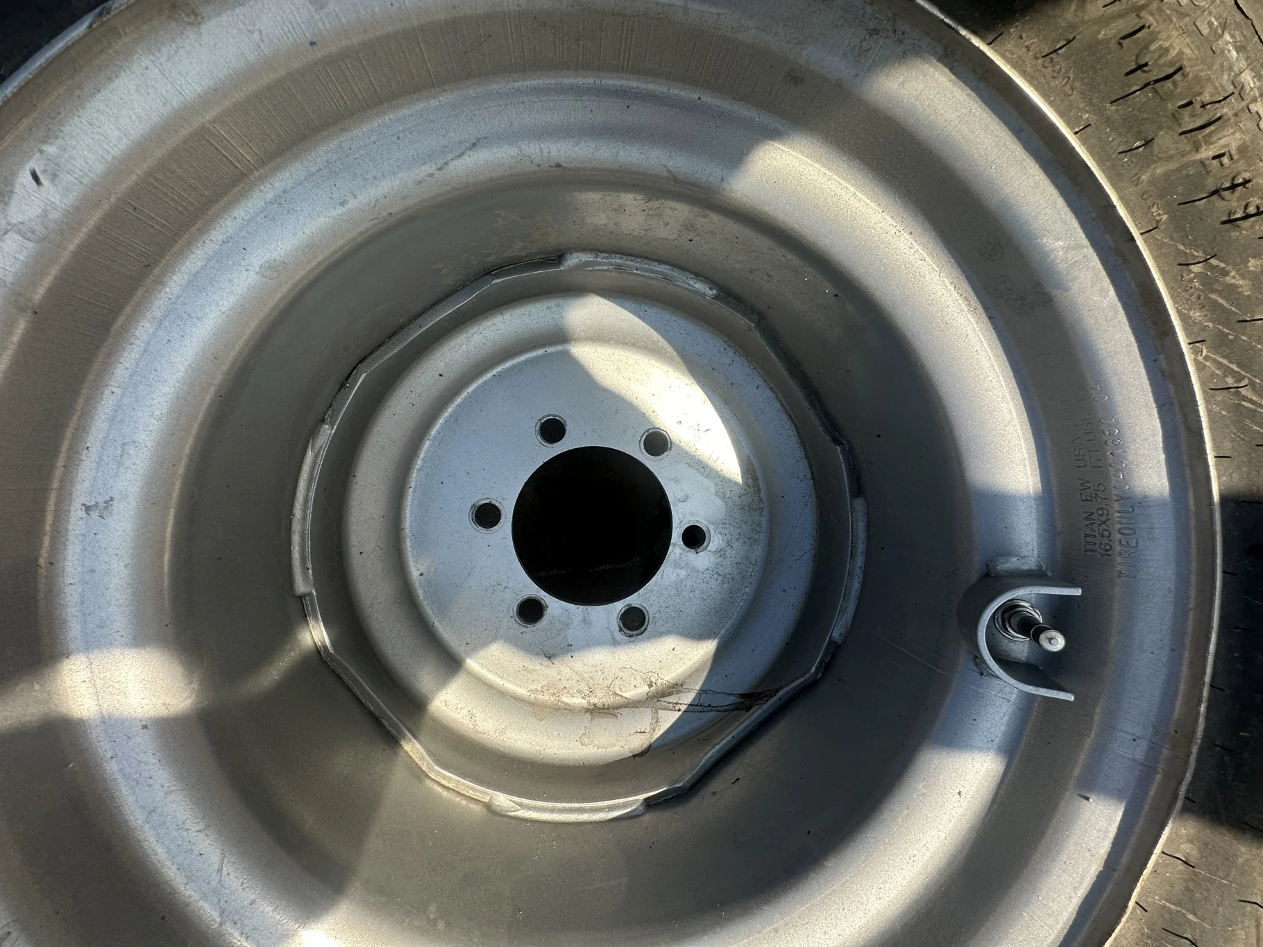 USED 95% 12-16.5 Titan Trac Loader NHS C(6Ply) TL on a 9.75 X 16.5 Silver Mist 6 Bolt Imp Wheel image 3
