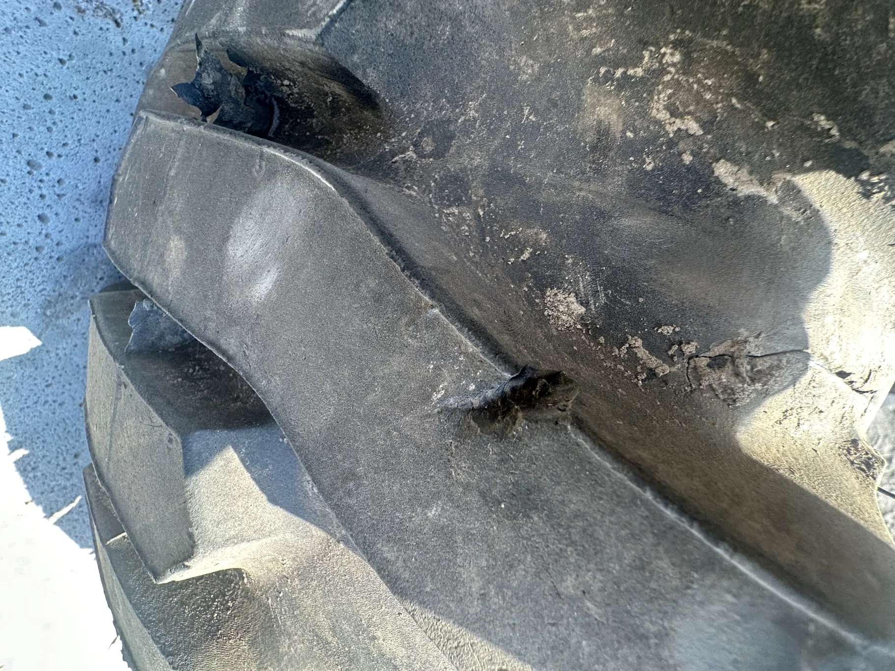 USED 95% 12-16.5 Titan Trac Loader NHS C(6Ply) TL on a 9.75 X 16.5 Silver Mist 6 Bolt Imp Wheel image 5