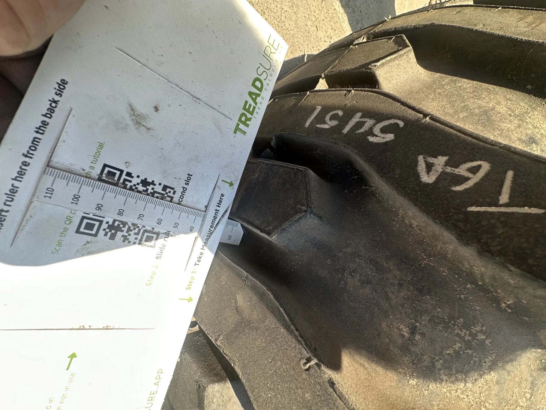 USED 95% 12-16.5 Titan Trac Loader NHS C(6Ply) TL on a 9.75 X 16.5 Silver Mist 6 Bolt Imp Wheel image 8