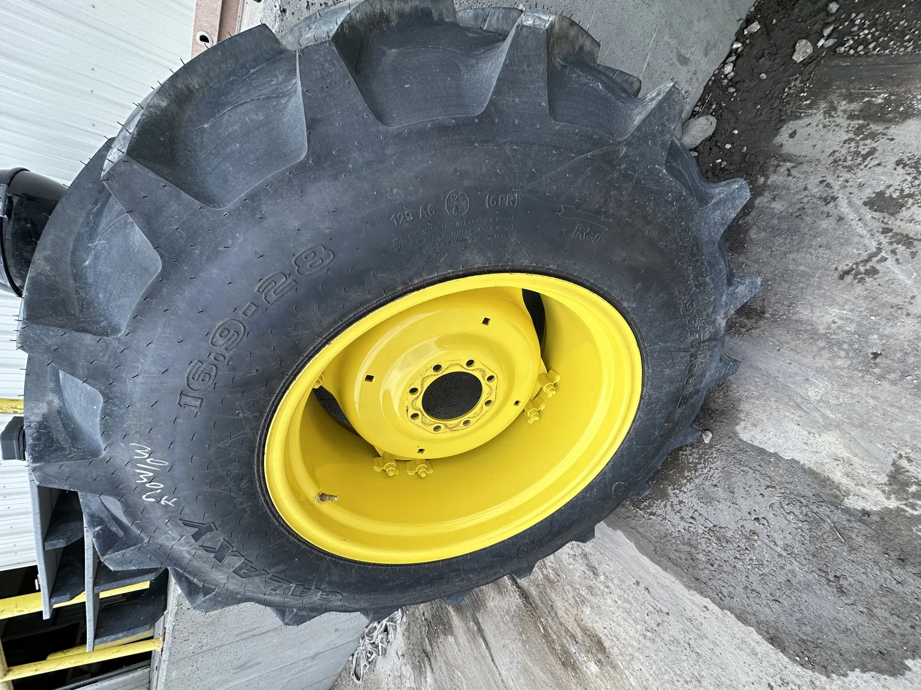 Take Off 16.9-28 Galaxy Agritrac 2 R-1 D(6Ply) TL on a 15 X 28 JD GKN Wheel (2 Bolt) with a 28/30"