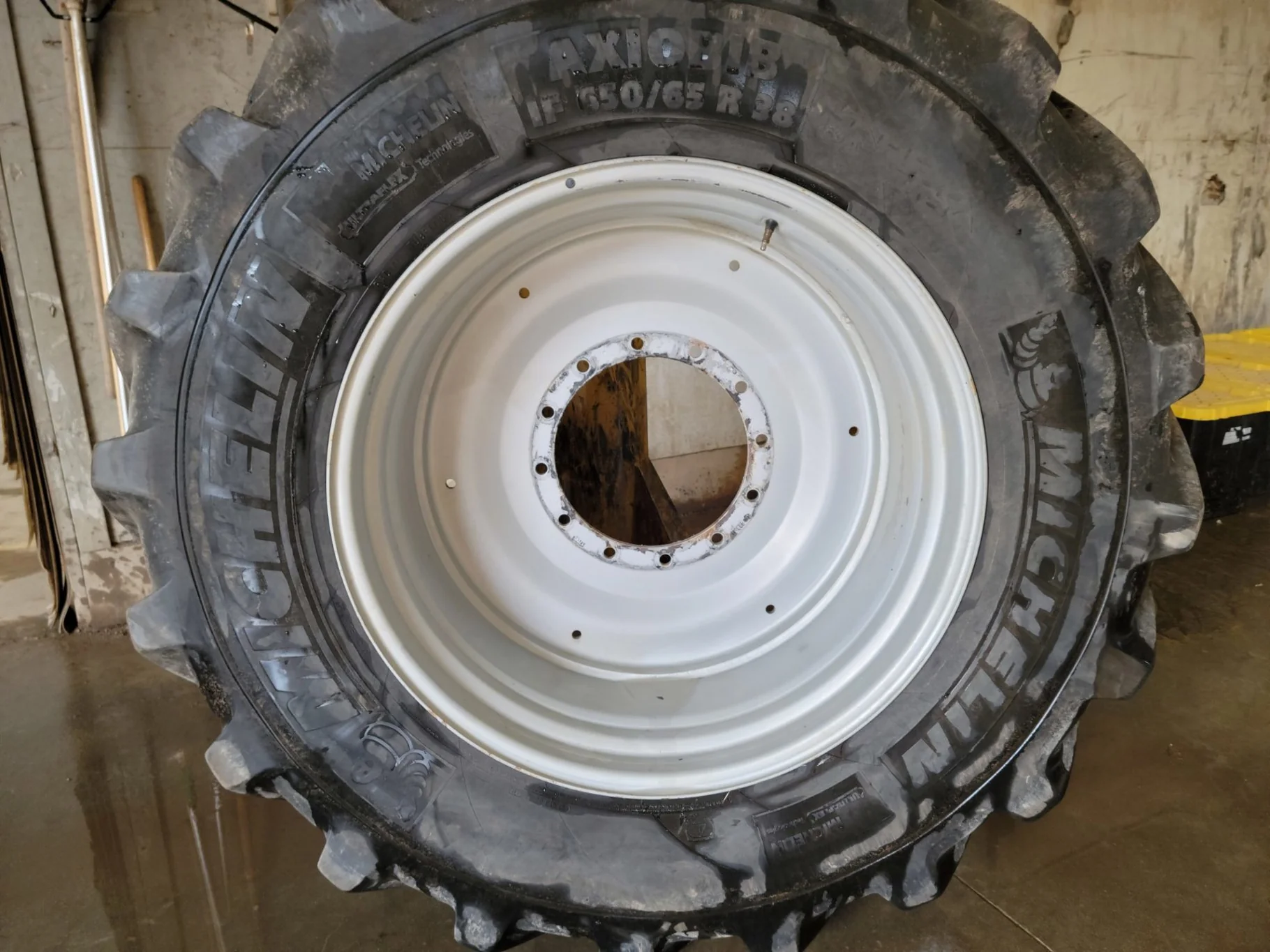 Used 80% IF650/65R38 Michelin AxioBib R-1W (169D) TL on a 23 x 38 Agco Gray 12 Bolt Formed Wheel (12