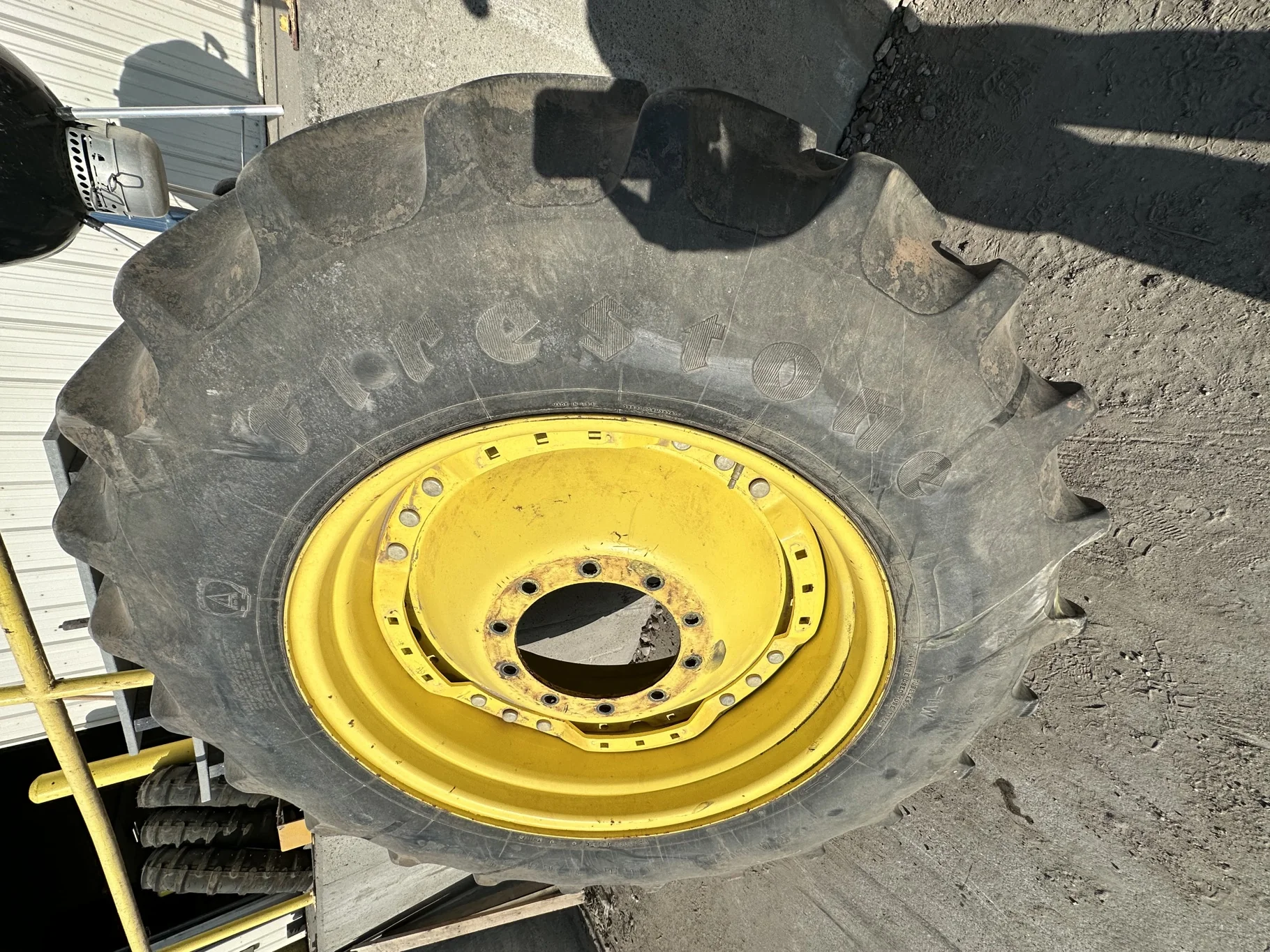Used 50% 420/85R34 Firestone Radial All Traction Deep Tread R-1W (147B) TL on a 15 x 34 JD Yellow