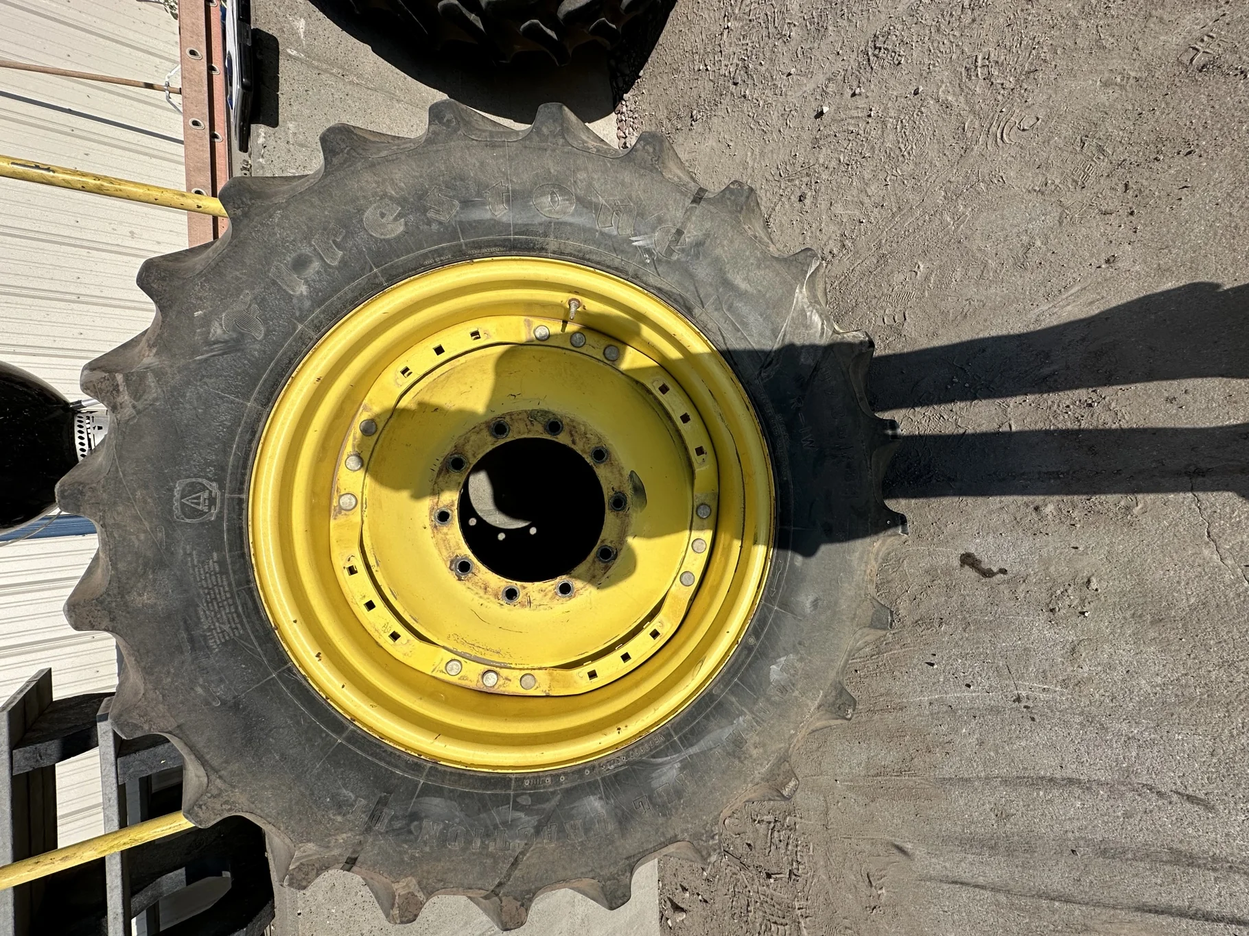 Used 50% 420/85R34 Firestone Radial All Traction Deep Tread R-1W (147B) TL on a 15 x 34 JD Yellow image 2