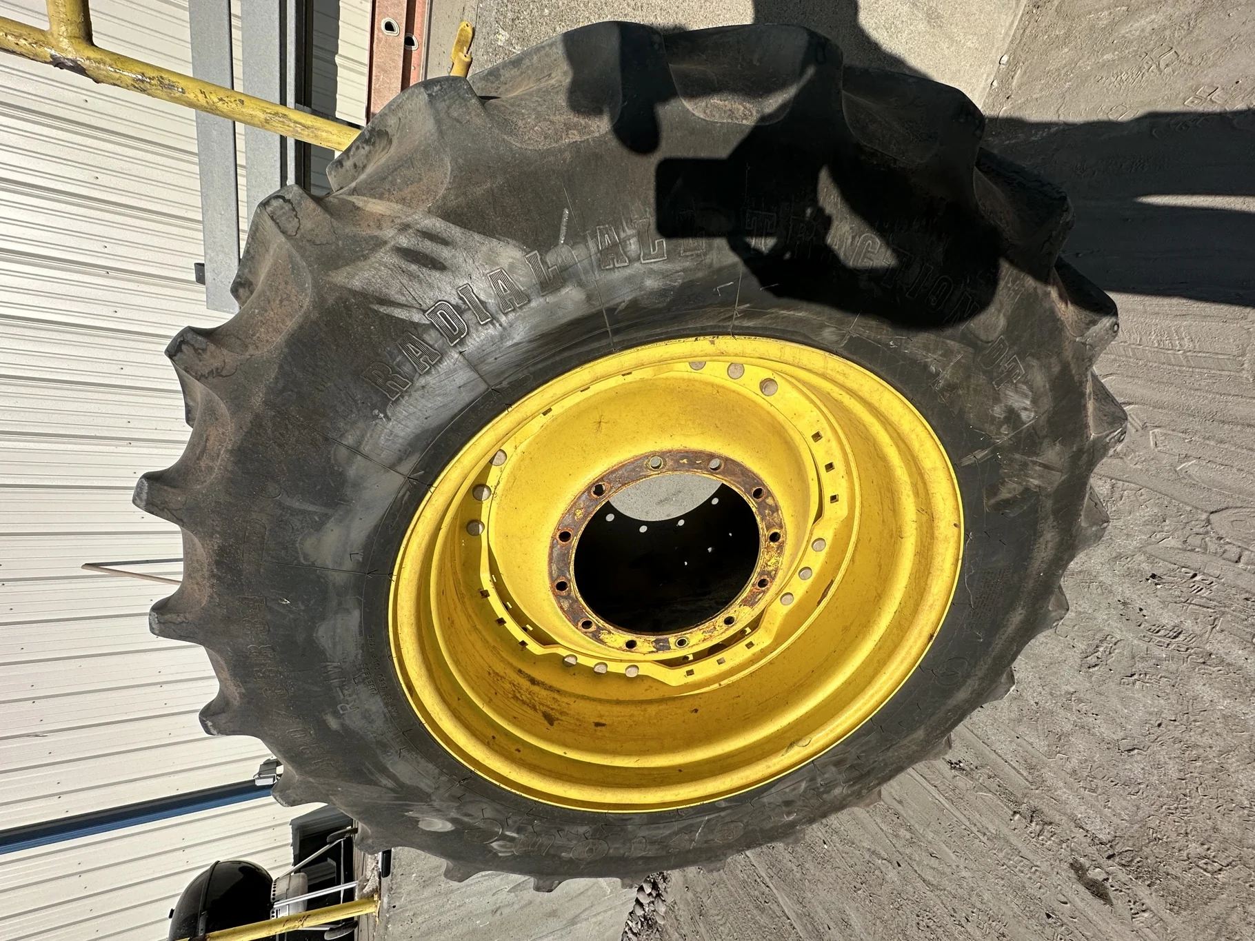 Used 70% 420/85R34 Firestone Radial All Traction DT R-1W 147B TL on a 15 x 34 JD Yellow Waffle