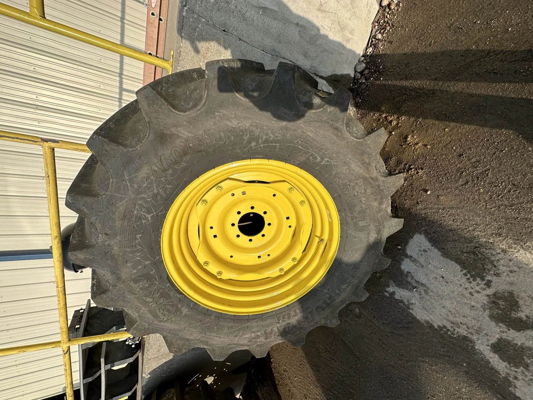USED 98% 460/85R30 BKT AMX RT855 R-1W (145A8) TL on a 15 X 30 JD Yellow 2 Bolt GKN Style Wheel
