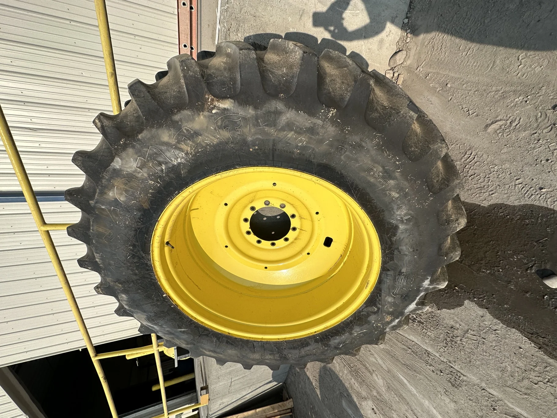 Used 80% 520/85R42 Firestone Radial Deep Tread 23 R-1W 167B TL on 18 x 42 John Deere Yellow 10 Bolt