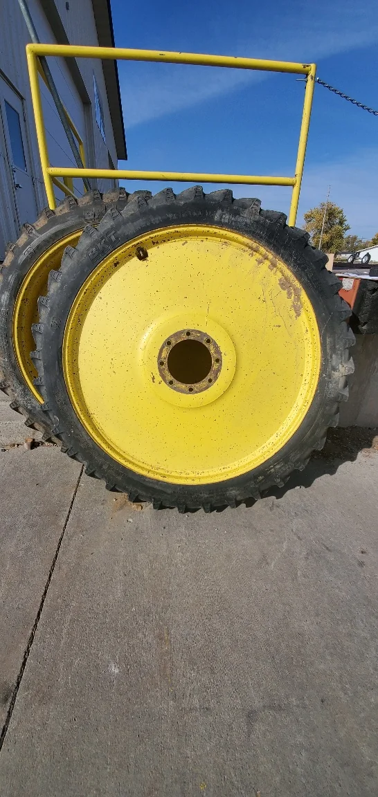Used 65% 230/95R48 BKT Agrimax RT955 (136A8/B) R-1 on a 8 x 48 JD Yellow Rim (8-10-8), Faded r