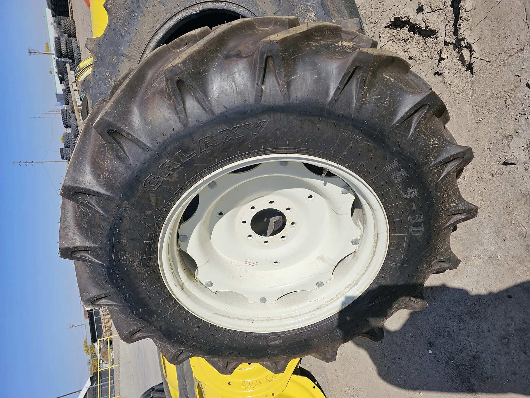 Take Off 16.9-30 Galaxy 324 R-1 (6Ply) TT on a 14 X 30 NH White 8 Loop Waffle Wheel  with a 3