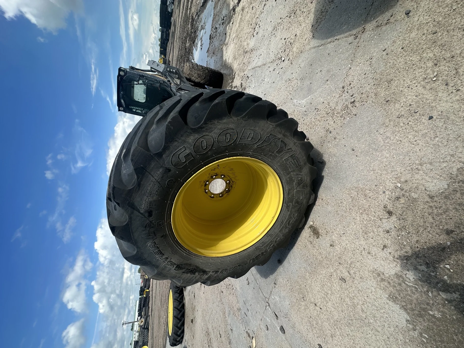 Used 85% LSW750/55R30 Goodyear Muck Master TL on a 25 x 30 JD Yellow 8 Bolt Wheel 8-8-6.0