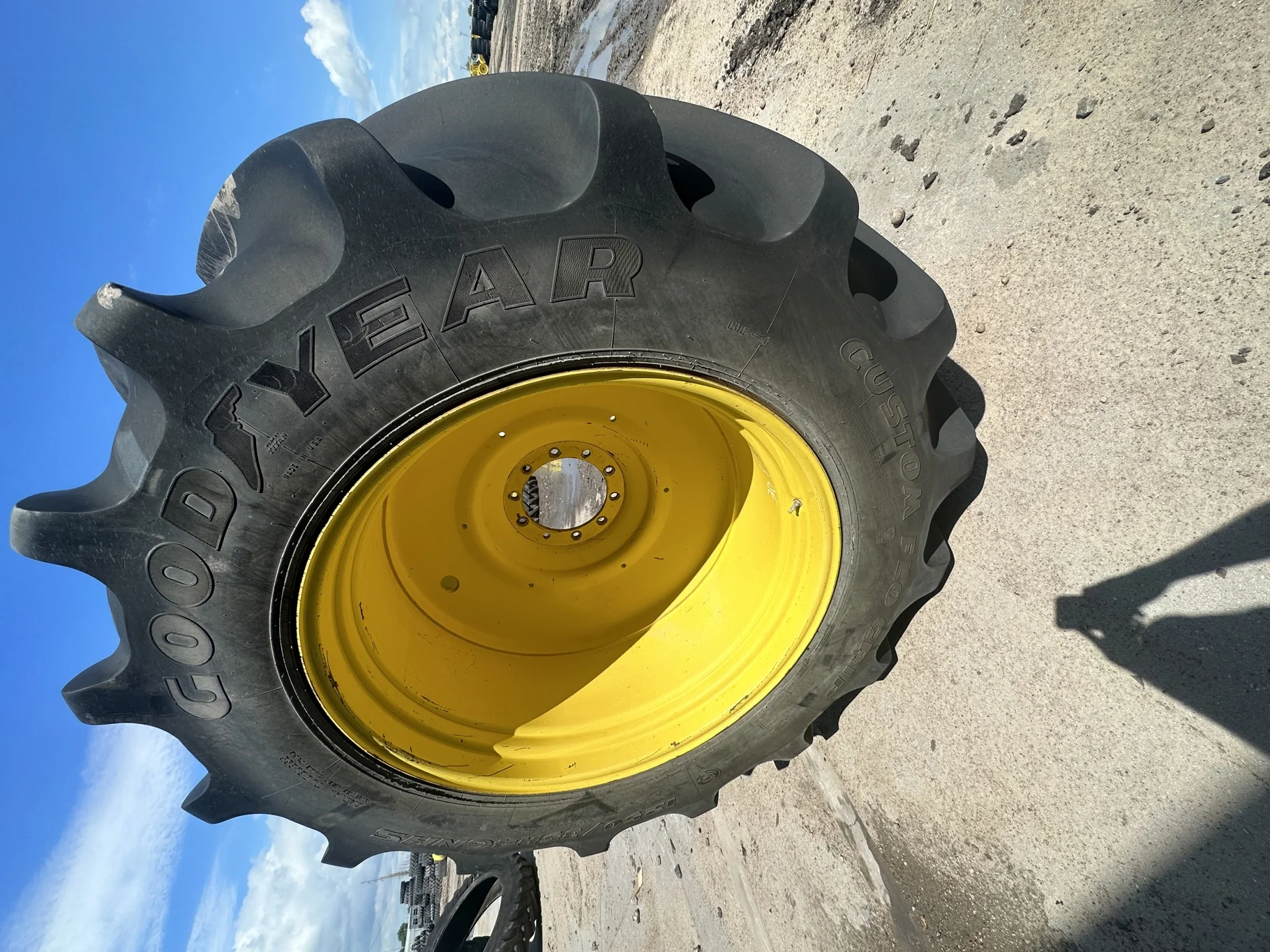 Used 90% LSW1250/35R46 Goodyear Custom Flo Grip R-2 (195B) TL on a 38 x 46 JD Yellow 10 Bolt C