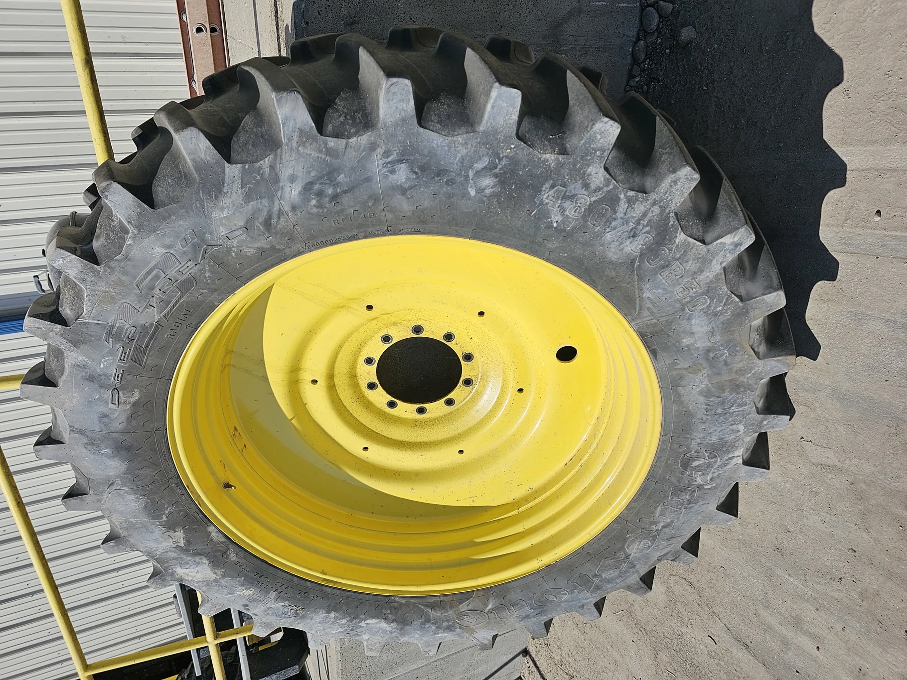 Used 75% 480/80R50 Firestone Radial Deep Tread 23 R-1W 159B TL on 15 x 50 John Deere Yellow 10 Bolt