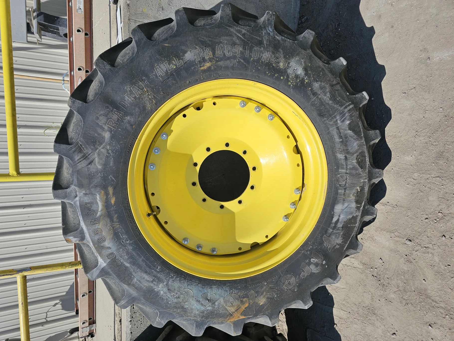 Used 79% 420/85R34 Firestone Radial All Traction DT R-1W 147B TL on a 15 x 34 JD Yellow Waffle image 2