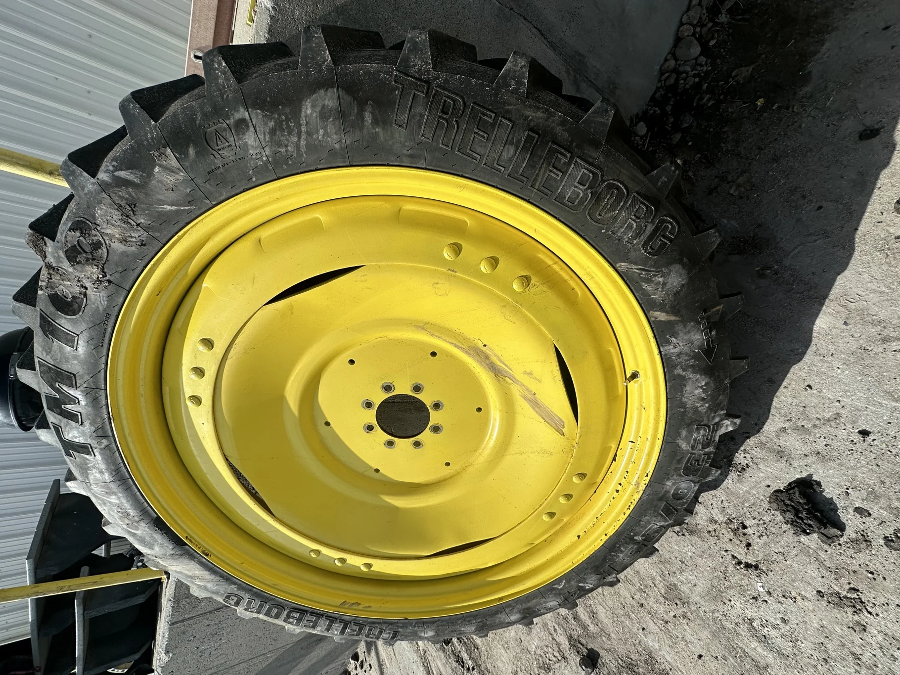 Used 80% 230/95R48 Trelleborg TM100 R-1 136B TL on a 8 x 48 JD Yellow 3 Bolt Waffle Wheel With