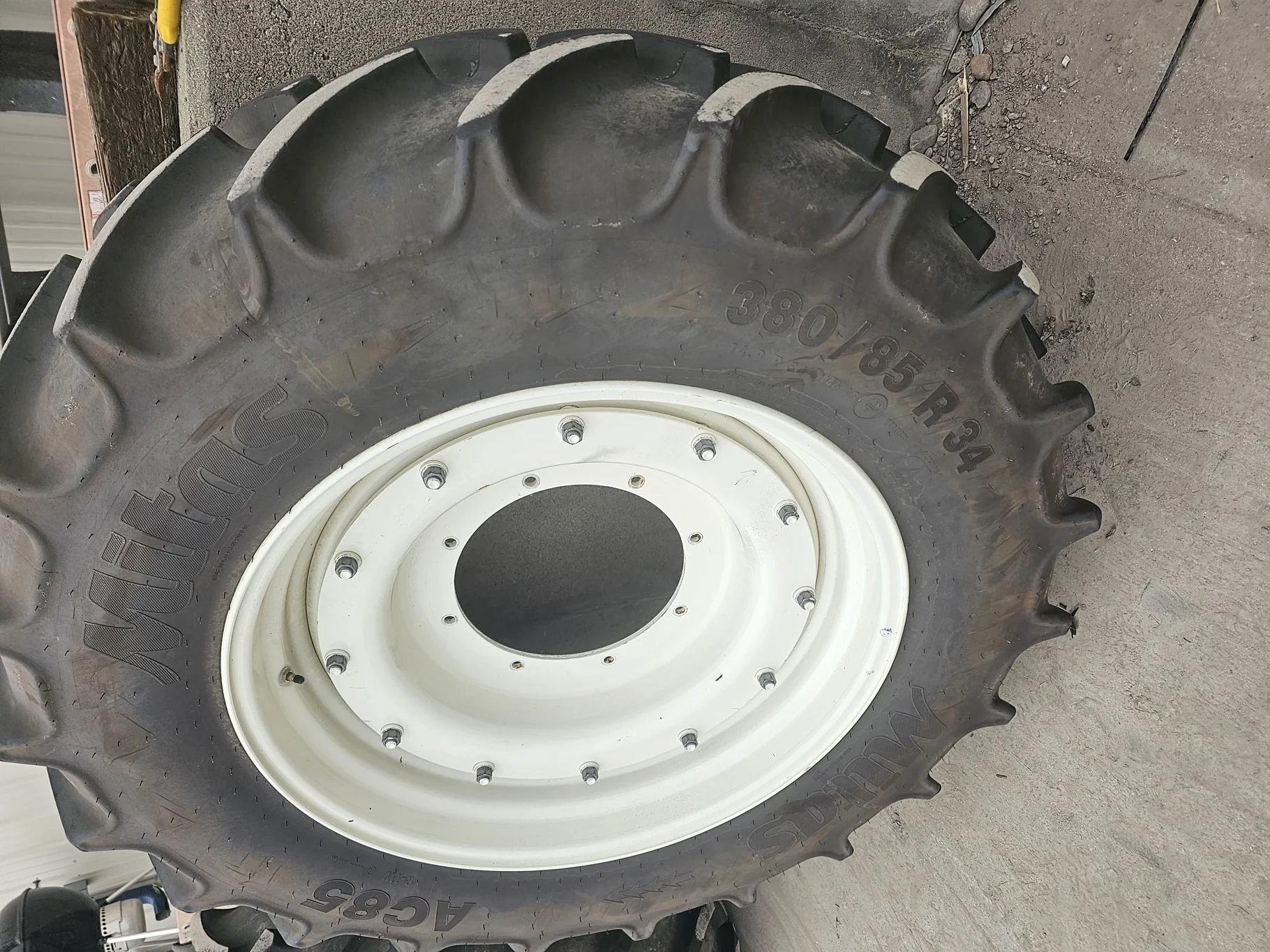 Used 90% 380/85R34 Mitas AC85 R-1W 146A8 on a 13 x 34 NH White 8 Bolt Waffle Wheel Assembly - Excell