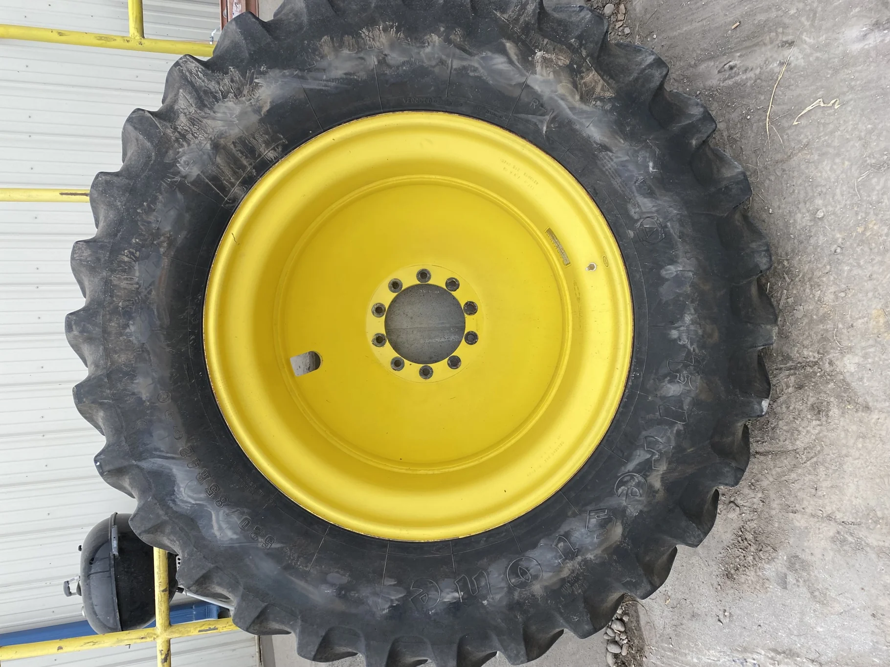 Used 75% 520/85R42 Firestone Radial All Traction 23 R-1W 157B TL on 18 x 42 JD Yellow 10 Bolt Dolly