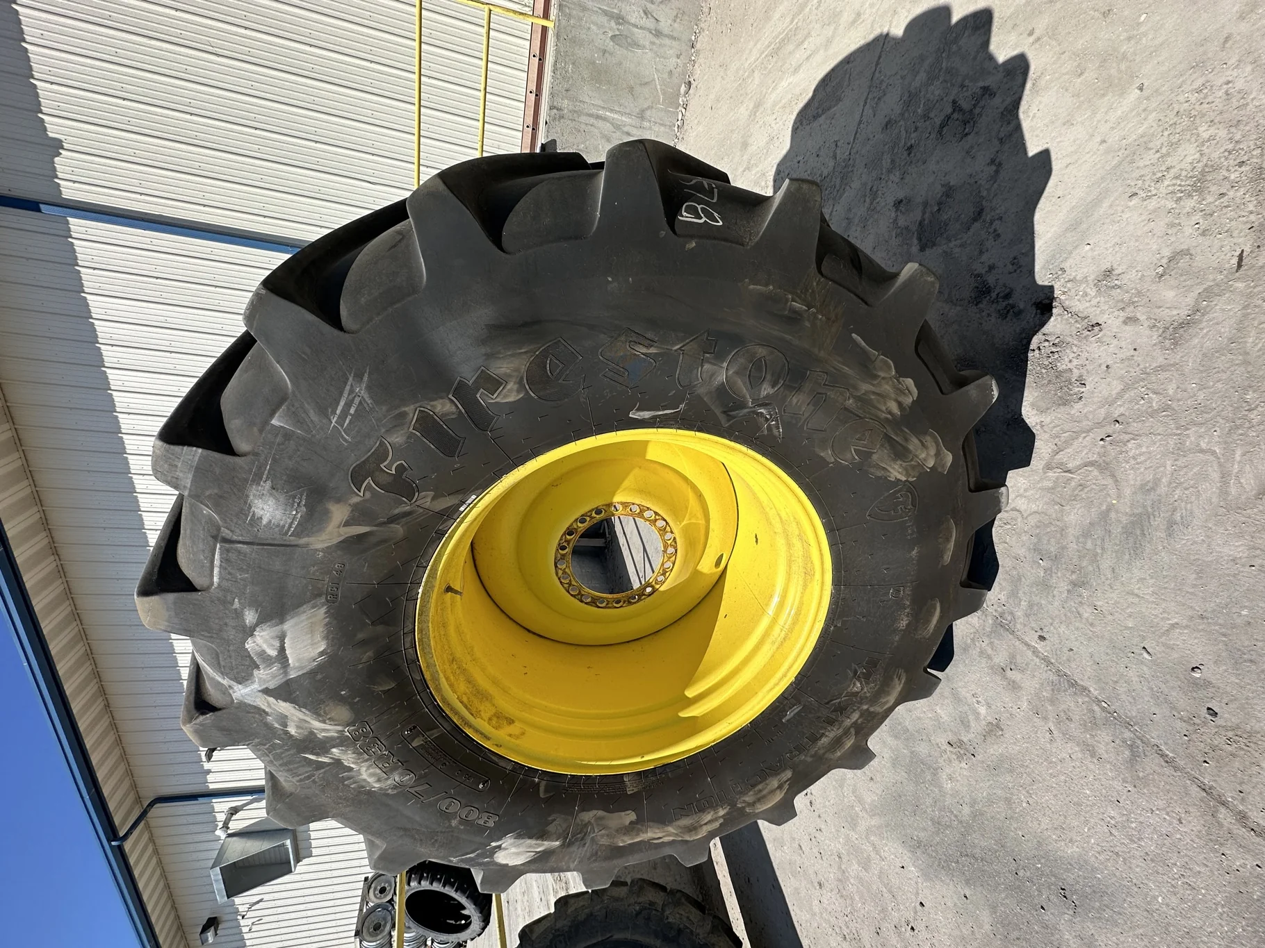 Used 85% 800/70R38 Firestone Maxi Traction R-1W 173D TL on a 27 x 38 JD Yellow 20 Bolt (.906)