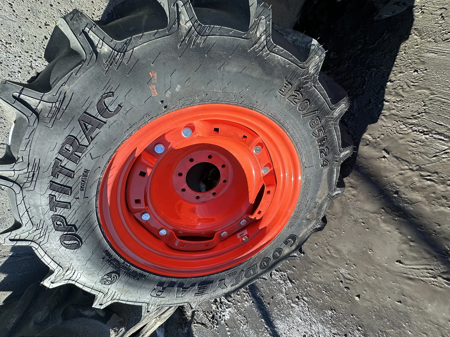 Take Off 320/85R24 Optitrac R-1W 122D TL on a 10 X 24 Kubota Orange Waffle Wheel (2 Bolt) with a image 2
