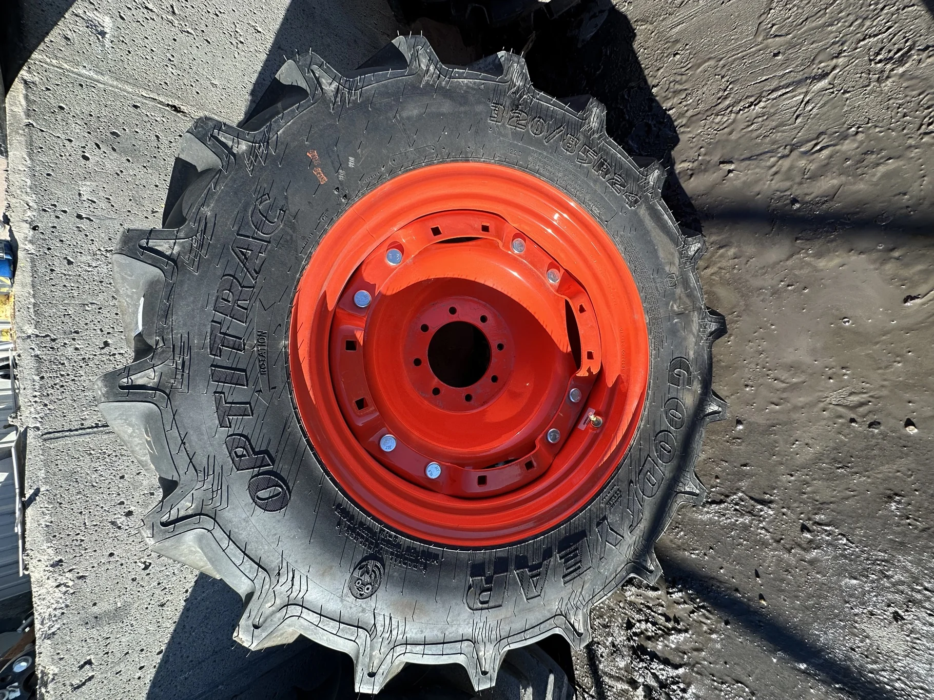 Take Off 320/85R24 Optitrac R-1W 122D TL on a 10 X 24 Kubota Orange Waffle Wheel (2 Bolt) with a image 3