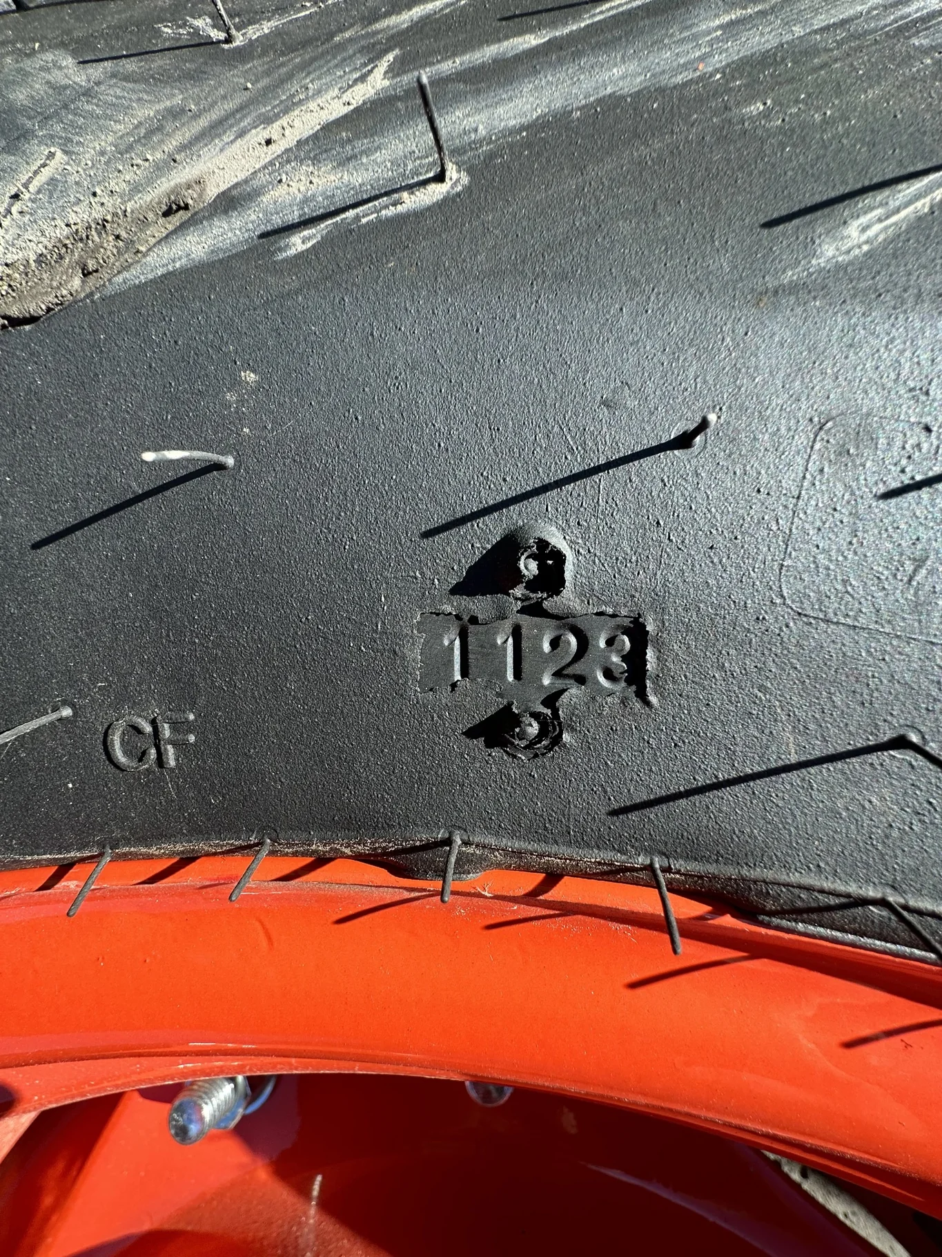 Take Off 320/85R24 Optitrac R-1W 122D TL on a 10 X 24 Kubota Orange Waffle Wheel (2 Bolt) with a image 7