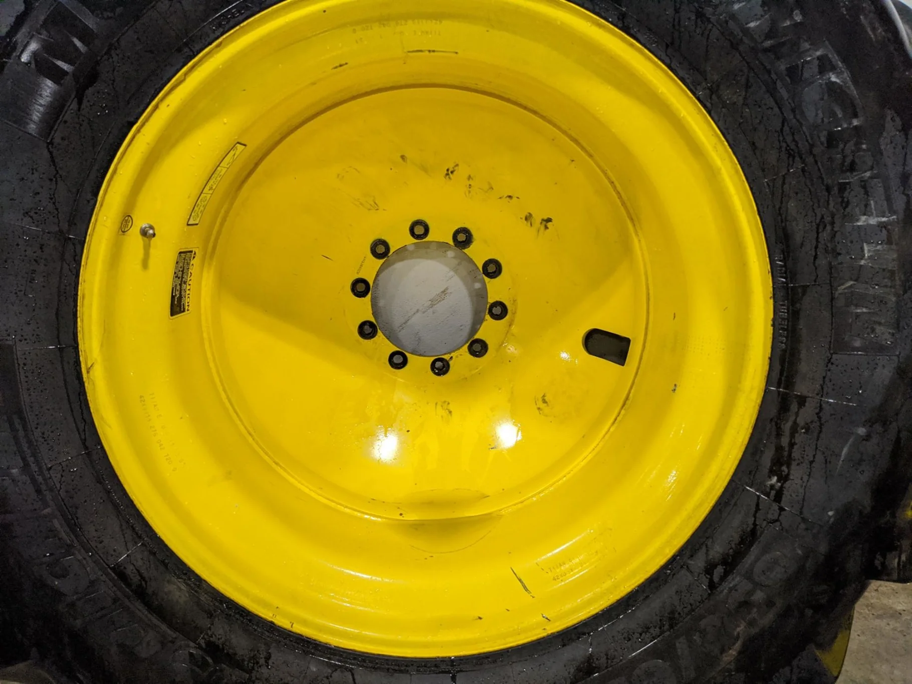 Used 90% 650/65R42 Michelin MachXBib (173A8/B) TL on a 18 x 42 JD Yellow 10 Bolt Inside Dolly image 2