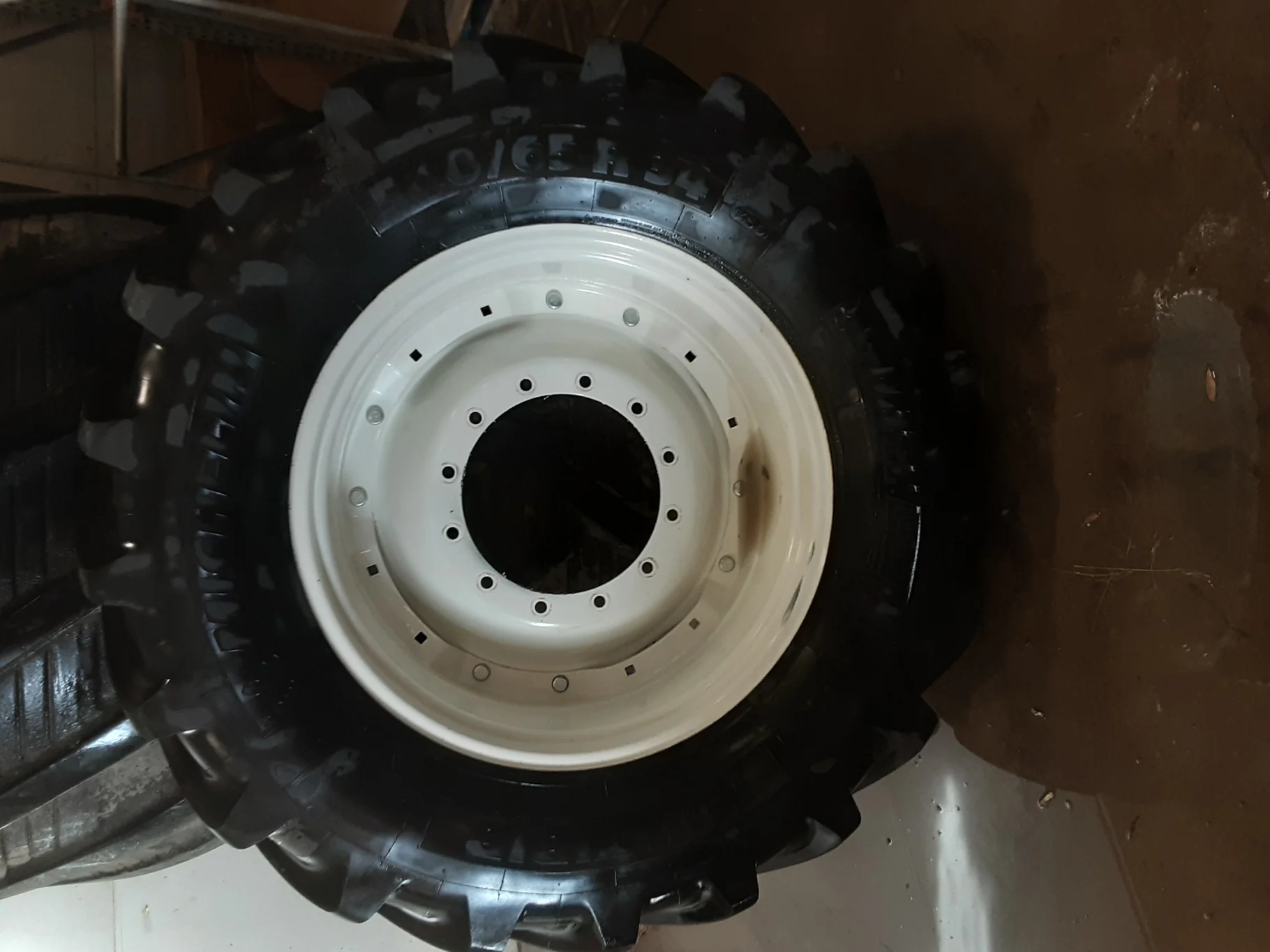 Used 95% 540/65R34 Michelin MultiBib R-1W (145D) TL on a 15 x 34 NH White Waffle Wheel (2 Hol