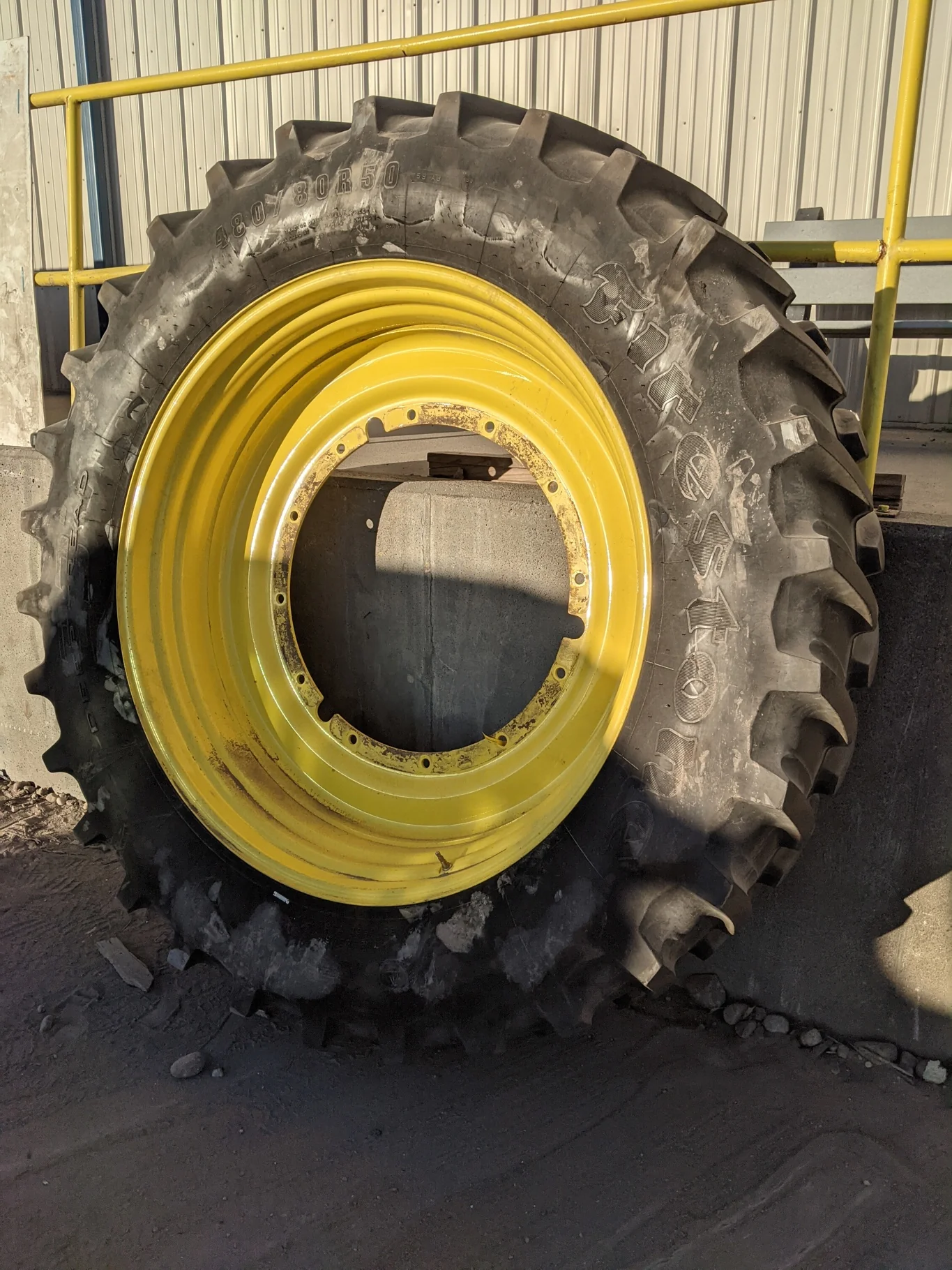 Used 65% 480/80R50 Firestone Radial Deep Tread 23 R-1W (159B) TL on a 15 x 50 JD Yellow Stub D