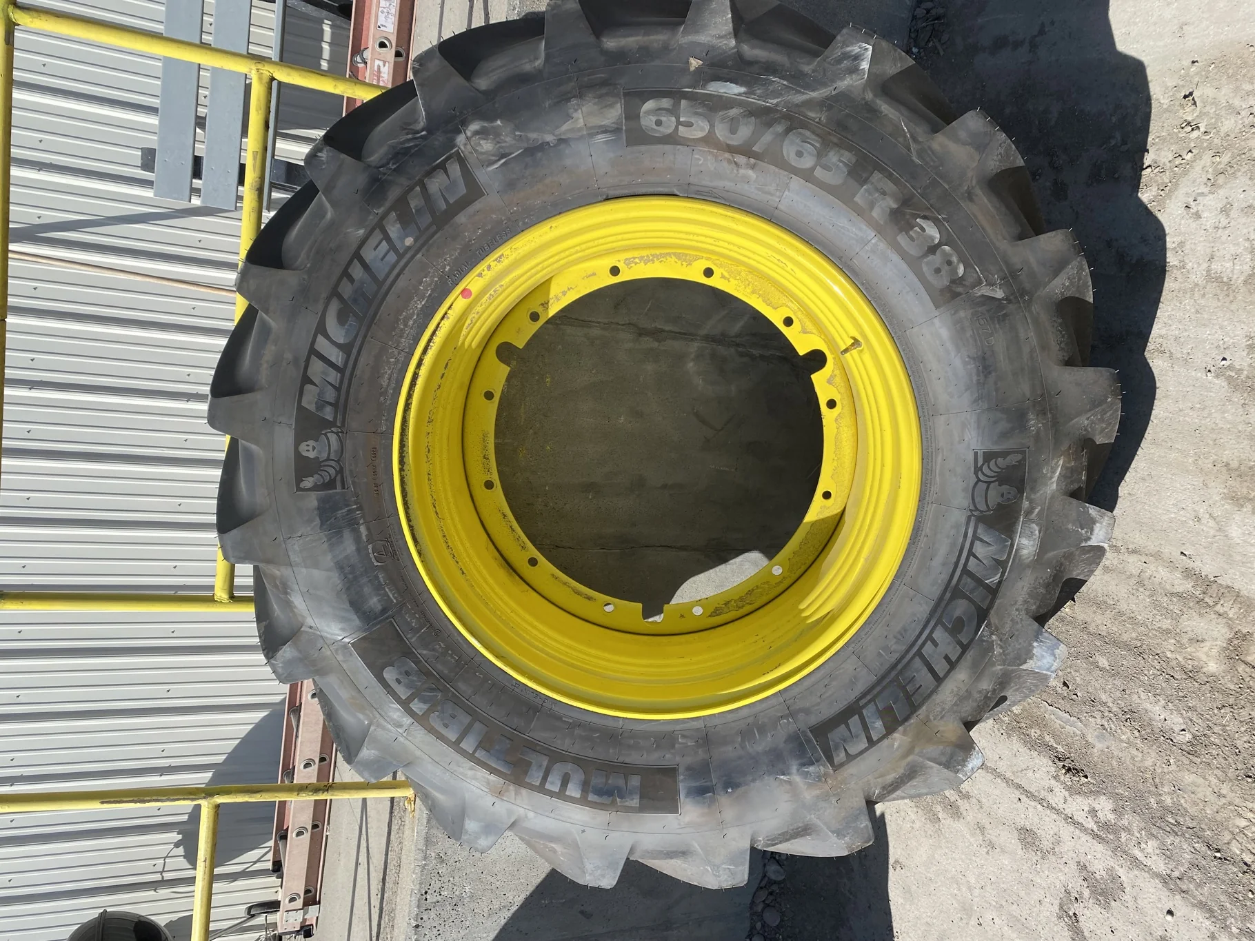 Take Off 650/65R38 Michelin MultiBib R-1W 157D TL on a 20 X 38 John Deere Yellow 12 Bolt (.937) Spra image 2
