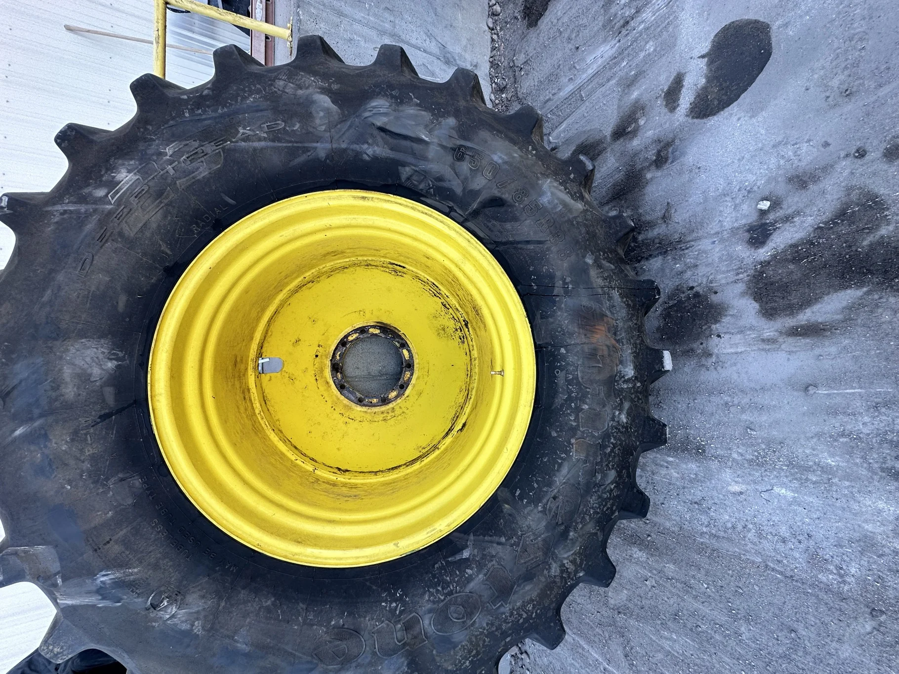 Used 80% 650/85R38 Firestone Radial Deep Tread 23 R-1W 173B TL on a 23 x 38 JD 10 Bolt Outside Dolly image 2