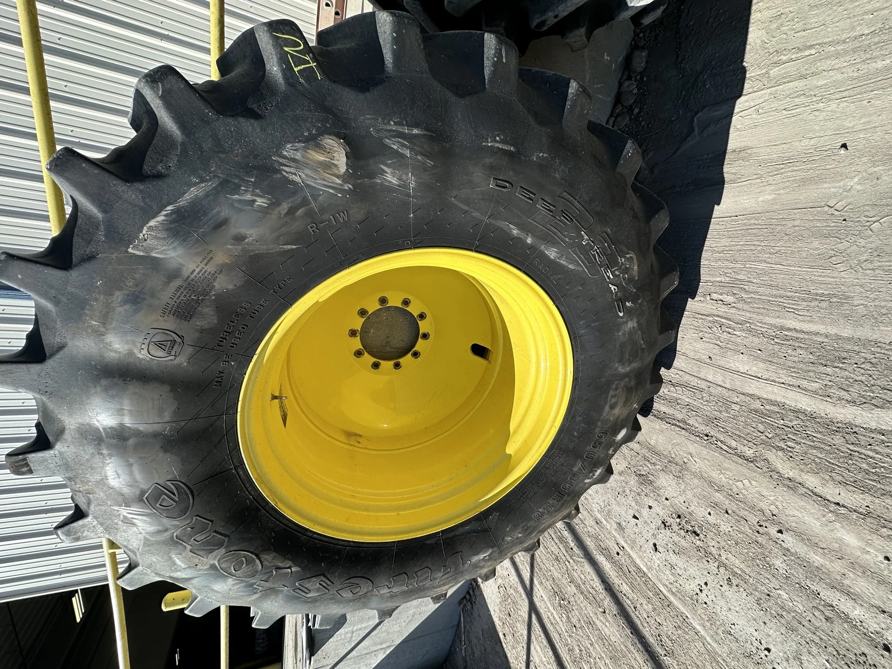 Used 85% 650/85R38 Firestone Radial Deep Tread 23 R-1W 173B TL on a 23 x 38 JD 10 Bolt Inside DD