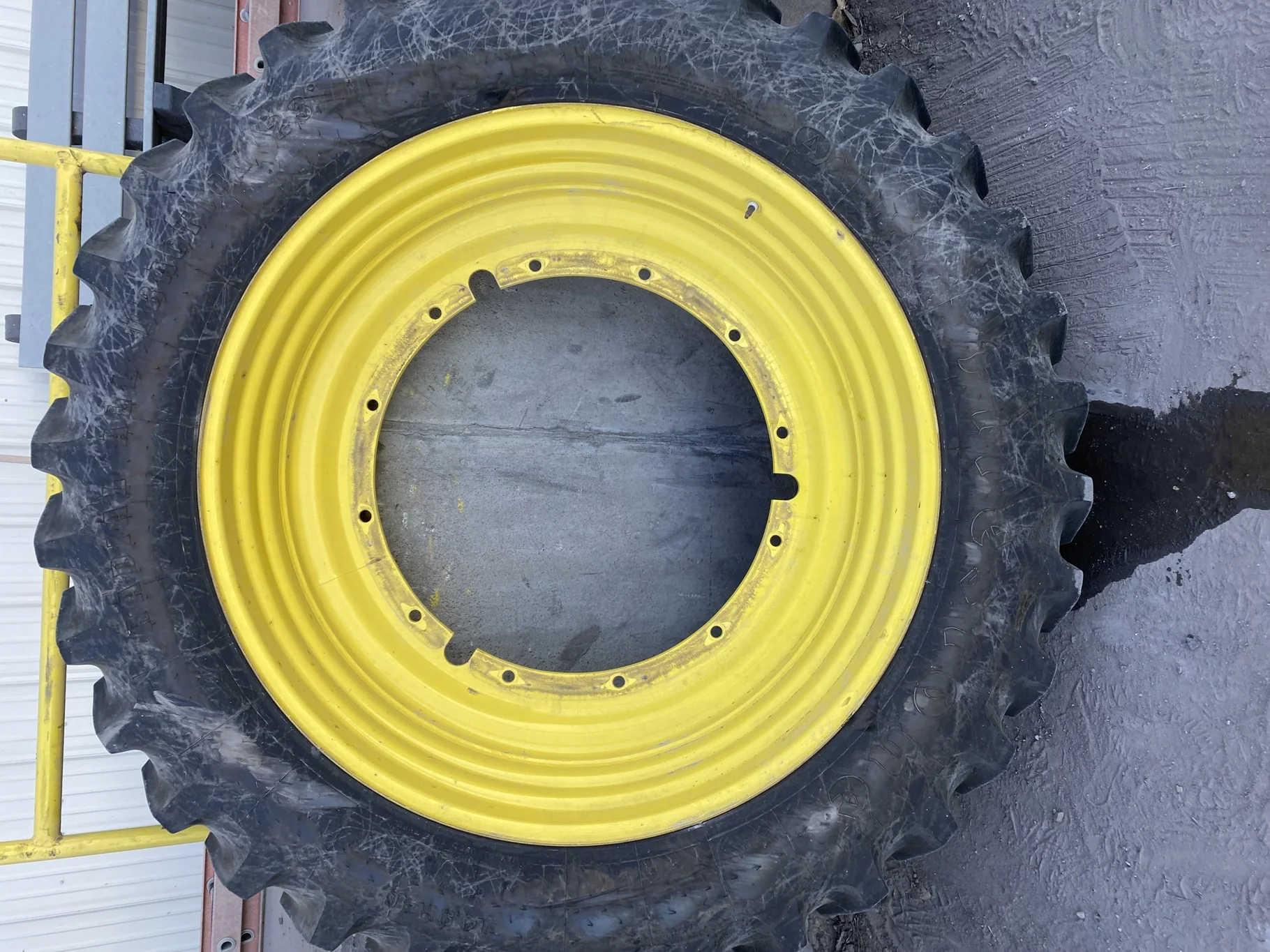 Used 95% 14.9R46 Firestone Radial All Traction 23 R-1 145B TL on 13 X 46 John Deere Yellow 12 Bolt