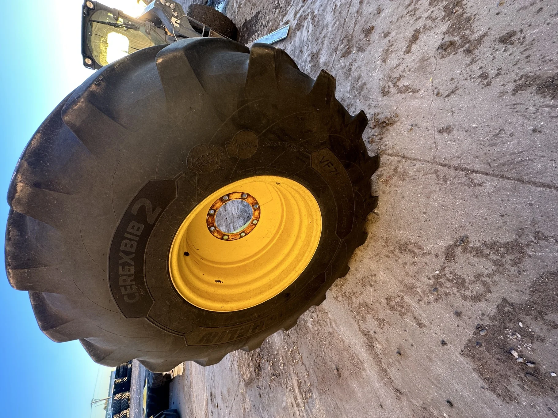 Used 80% VF750/65R26 CFO+ Michelin CerexBib 2 R-1W 180A8 TL on a 25 x 26 JD Yellow 8 Bolt (.90