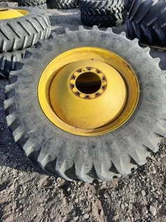 Used 70% 520/85R42 Firestone Radial all Traction 23 on 18 x 42 JD Yellow 10 Bolt Dolly Dual