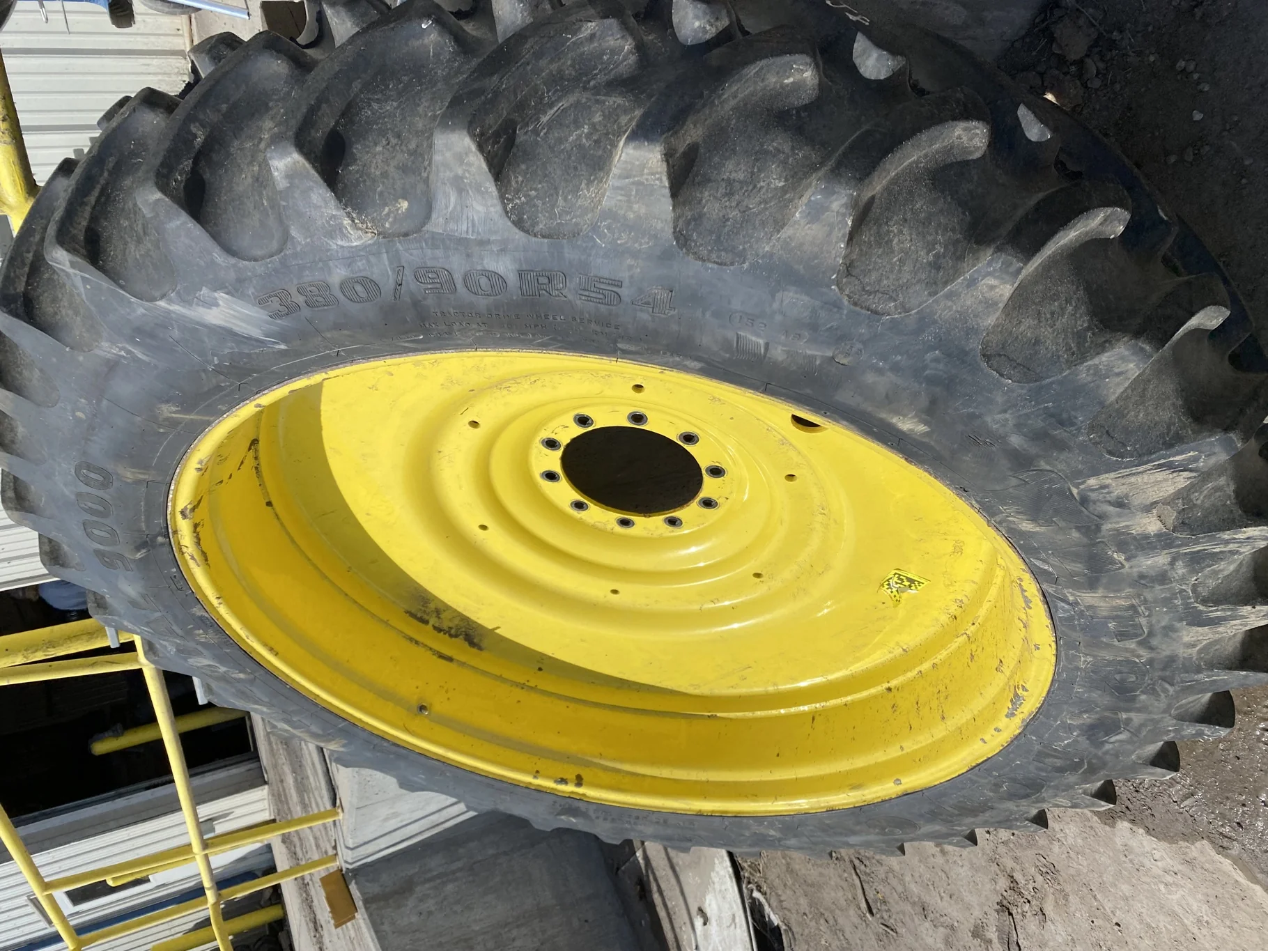 Used 98% 380/90R54 Firestone Radial 9000 R-1W (152B) TL on a 12 x 54 JD Yellow 10 Bolt (.937)