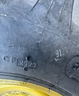 Take Off 8-16 Titan Hi Traction Lug R-1 C(6Ply) TL on a 6 X 16 JD Yellow 6 (.594) Bolt w/90° C