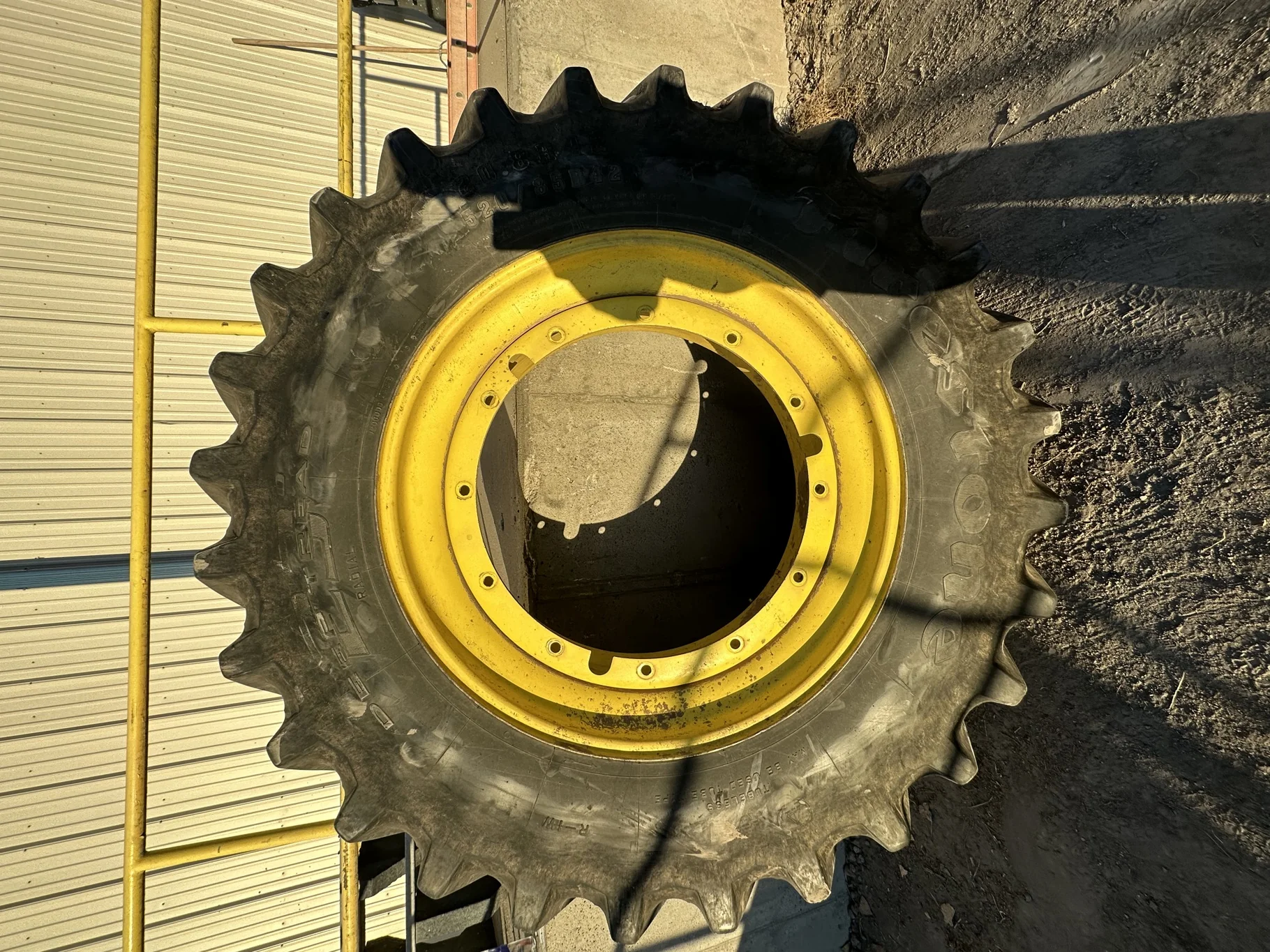 Used 65% 520/85R42 Firestone Radial Deep Tread 23 R-1W (157B) TL on 18 x 42 John Deere Yellow 12 Bo image 2