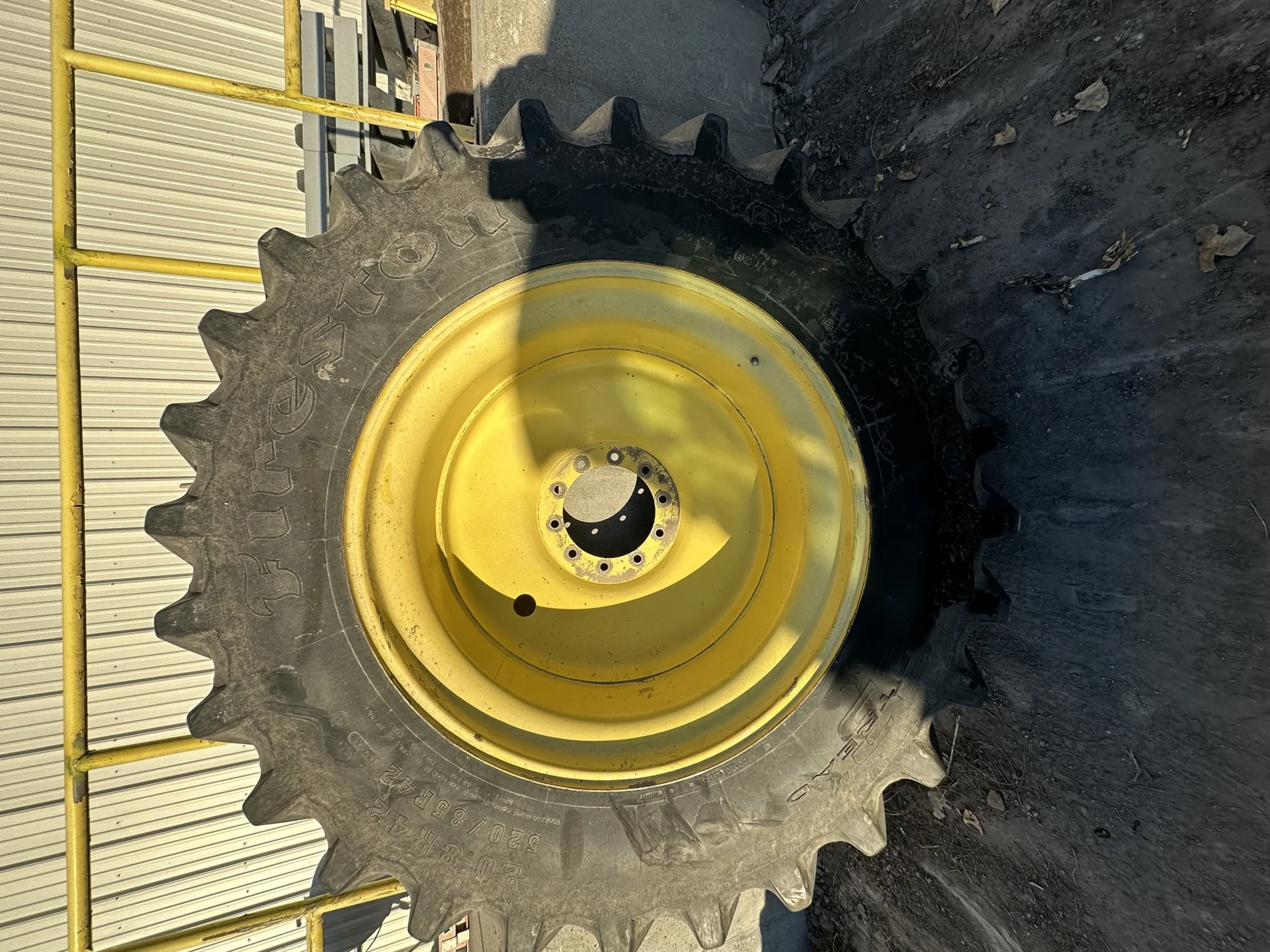 Used 70% 520/85R42 Firestone Radial Deep Tread 23 R-1W 157B TL on 18 x 42 John Deere Yellow 10 Bolt image 2