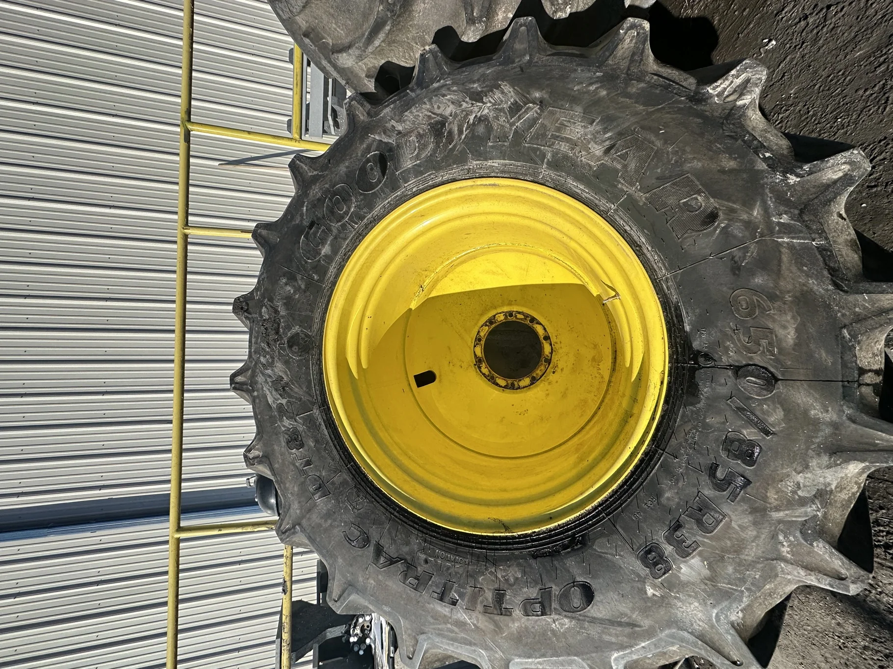 Used 90% 650/85R38 Goodyear Optitrac 173D R-1W TL on a 23 x 38 JD Yellow 10 Bolt Inside Dolly image 2