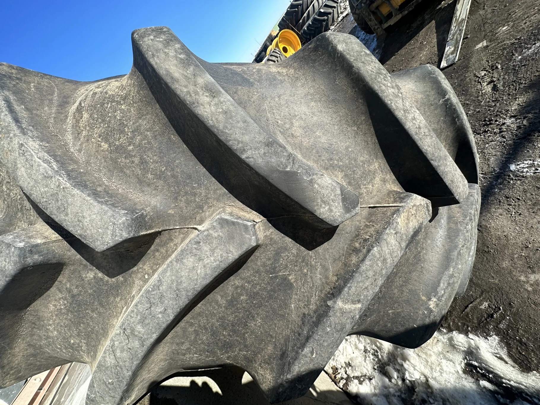 Used 90% 650/85R38 Goodyear Optitrac 173D R-1W TL on a 23 x 38 JD Yellow 10 Bolt Inside Dolly image 4