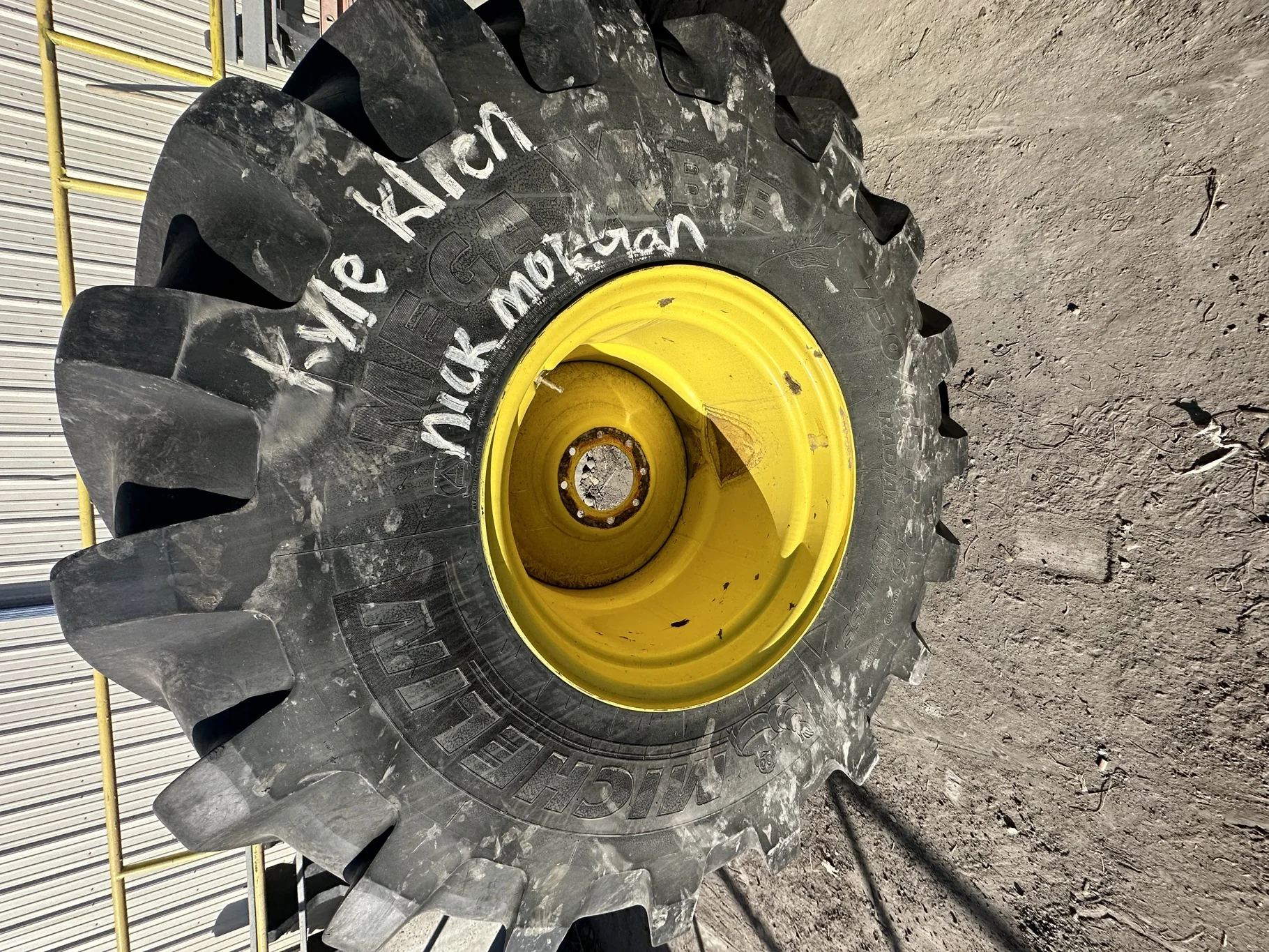 Used 70% 750/65R26 Michelin MegaXBib R-1W 171A8/171B TL on a 25 x 26 JD Yellow 8 Bolt Rear Com image 2