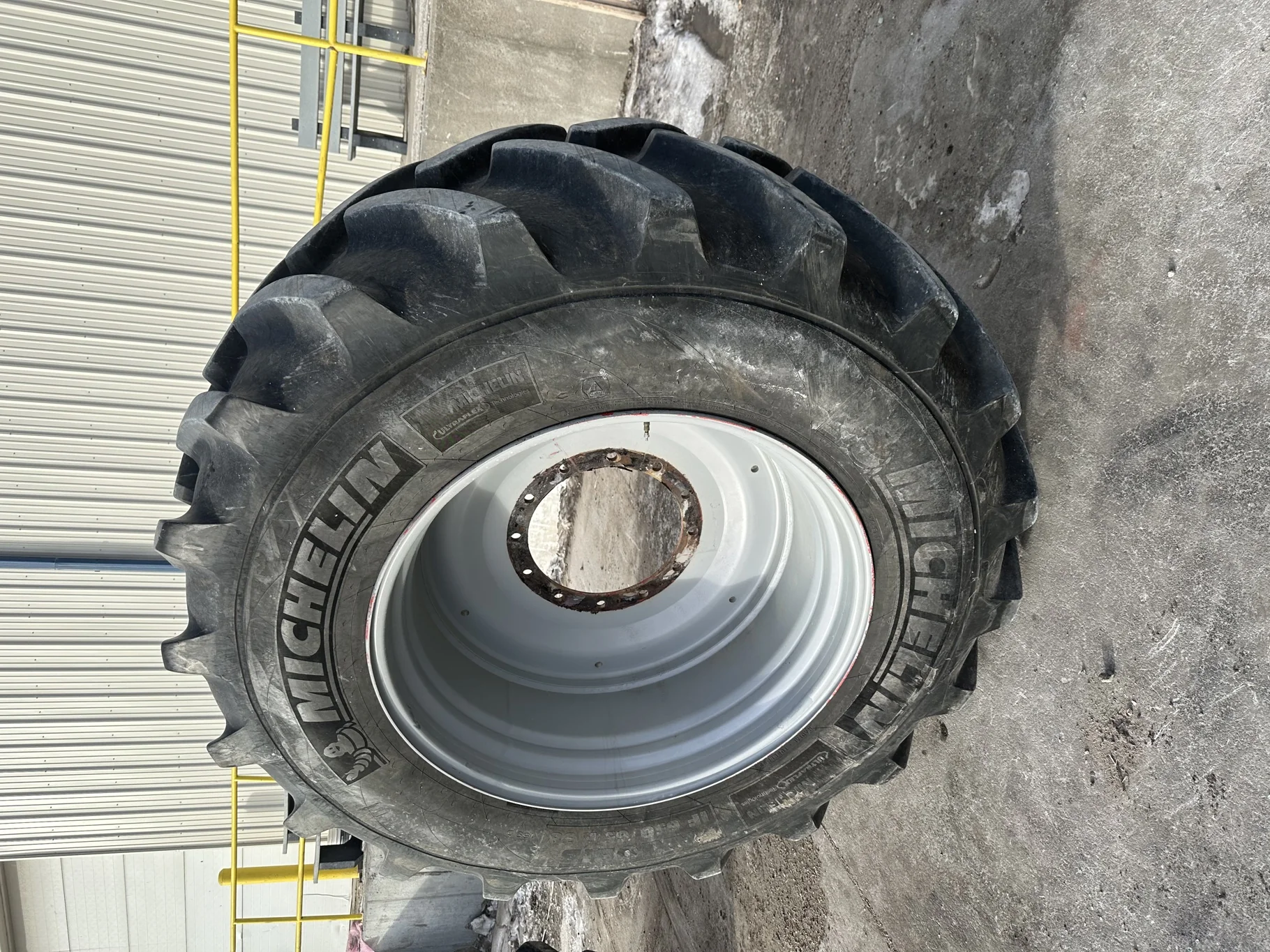 Used 85% IF650/65R38 Michelin AxioBib R-1W (169D) TL on a 23 x 38 Agco Gray Front Rim (12-16.732-14.