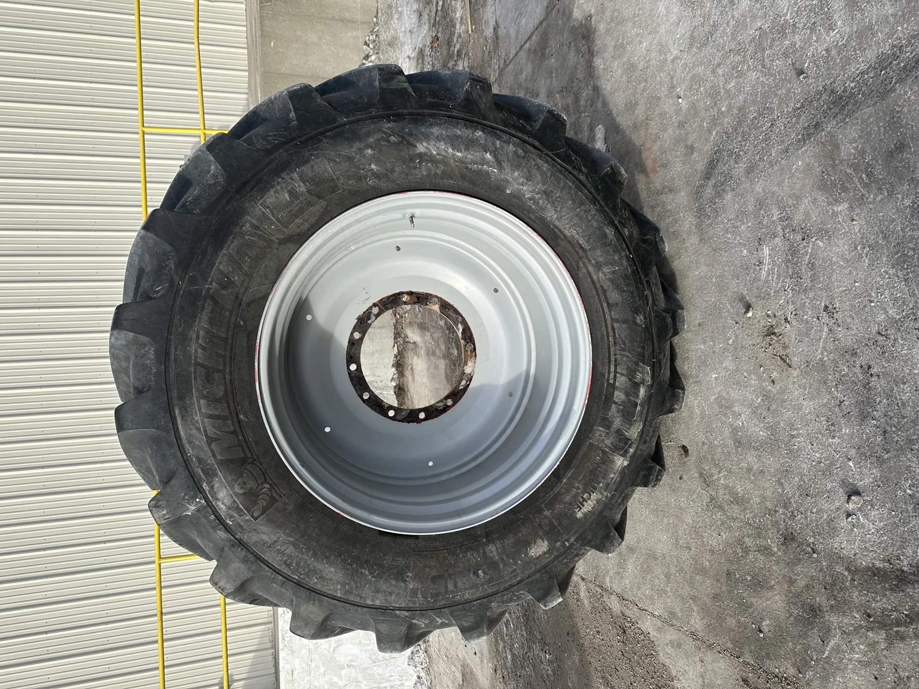Used 85% IF650/65R38 Michelin AxioBib R-1W (169D) TL on a 23 x 38 Agco Gray Front Rim (12-16.732-14. image 2