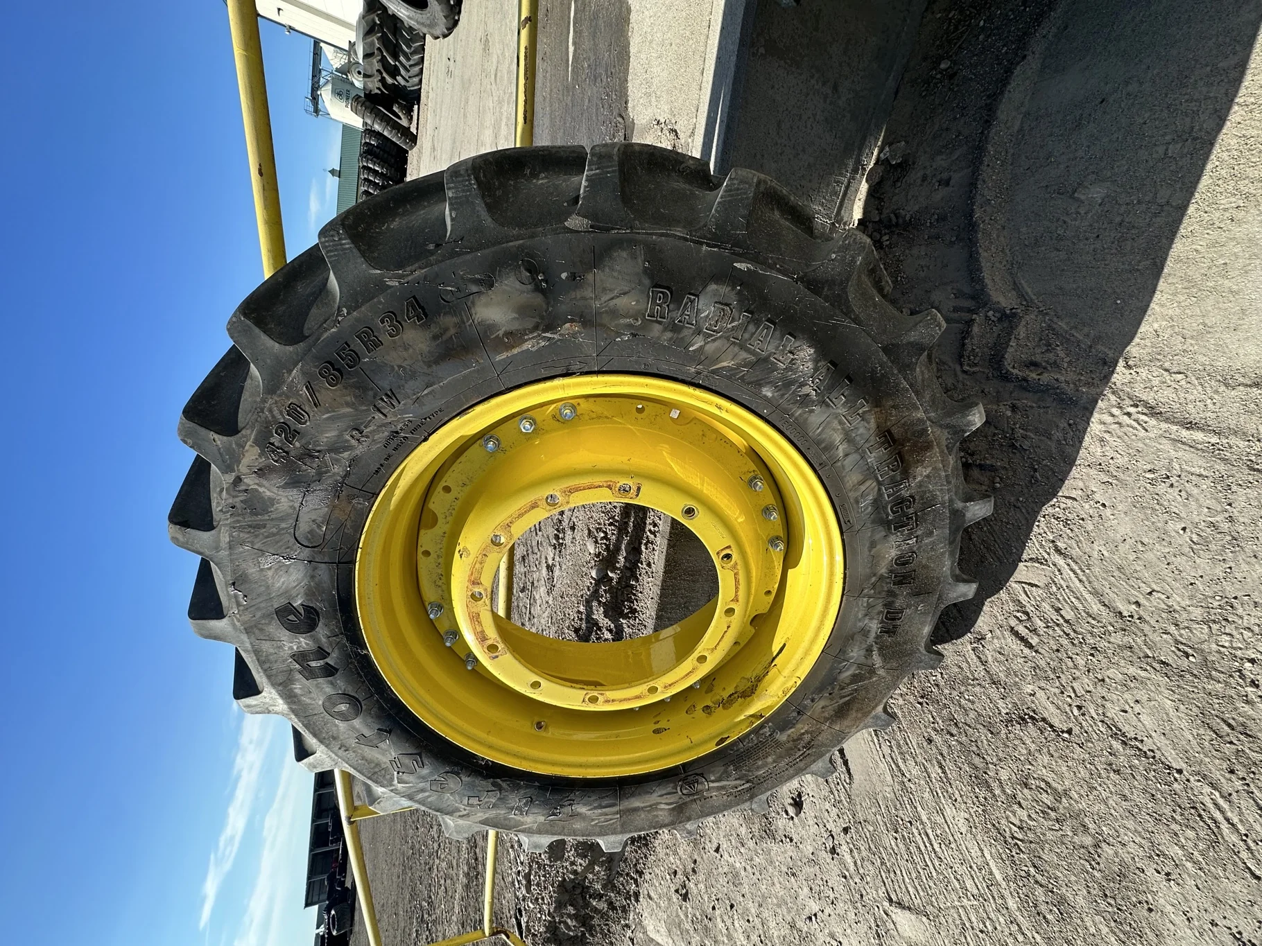 Used 85% 420/85R34 (16.9R34) Firestone Radial All Traction DT R-1W (147A8/147B) TL on a 15 x 34 JD Y